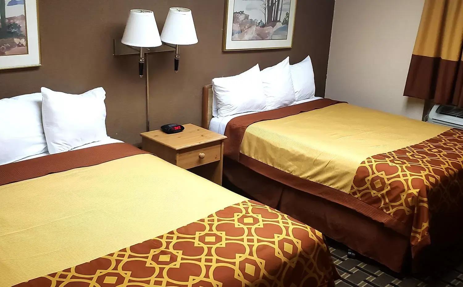 Bed in Coratel Inn & Suites by Jasper Mankato