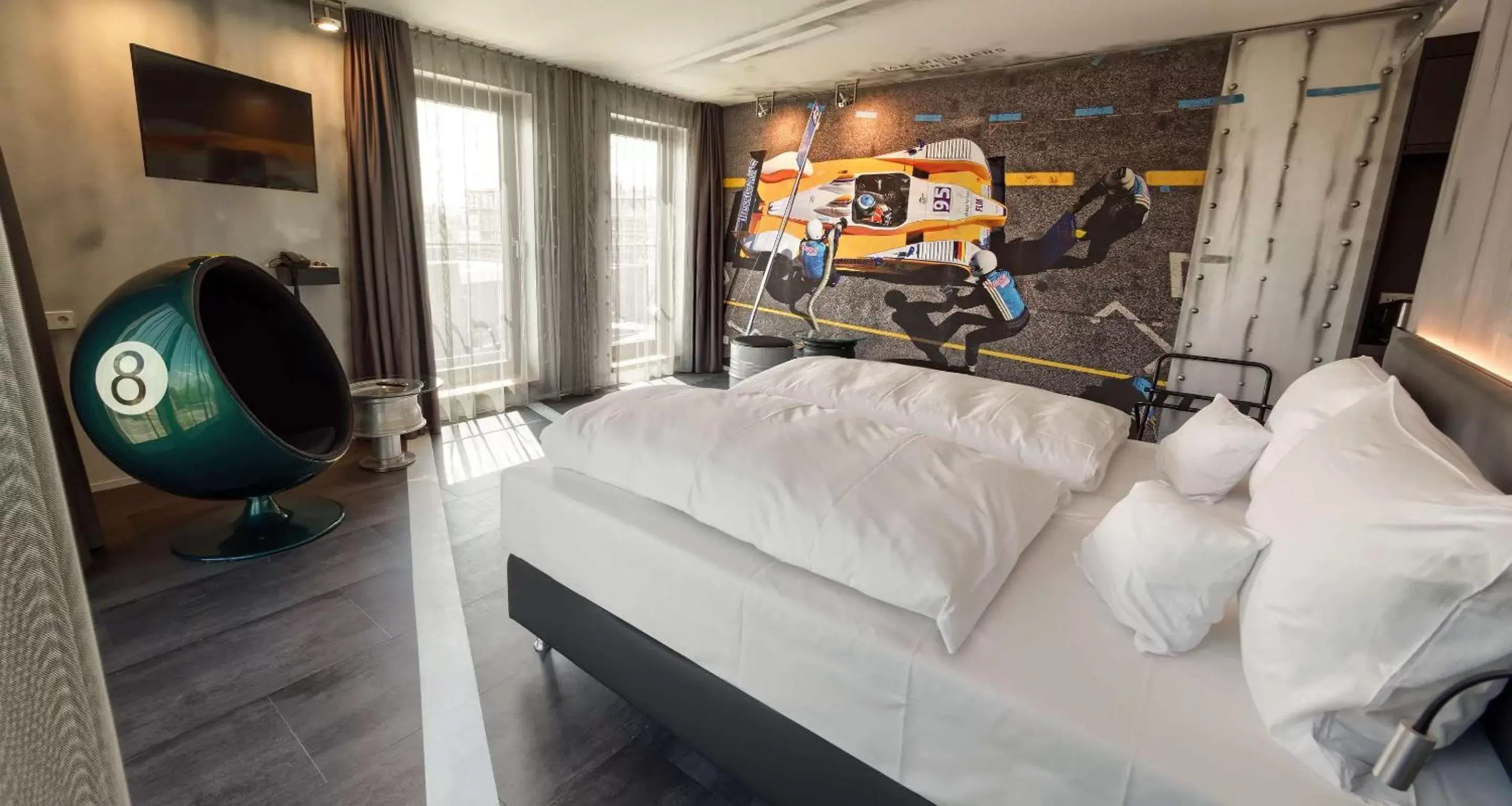Bedroom, Seating Area in V8 HOTEL Motorworld Region Stuttgart