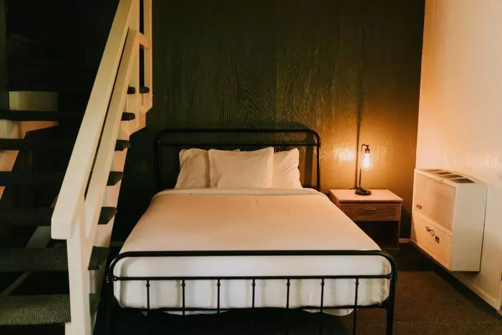 Bed in The Long Barn Lodge