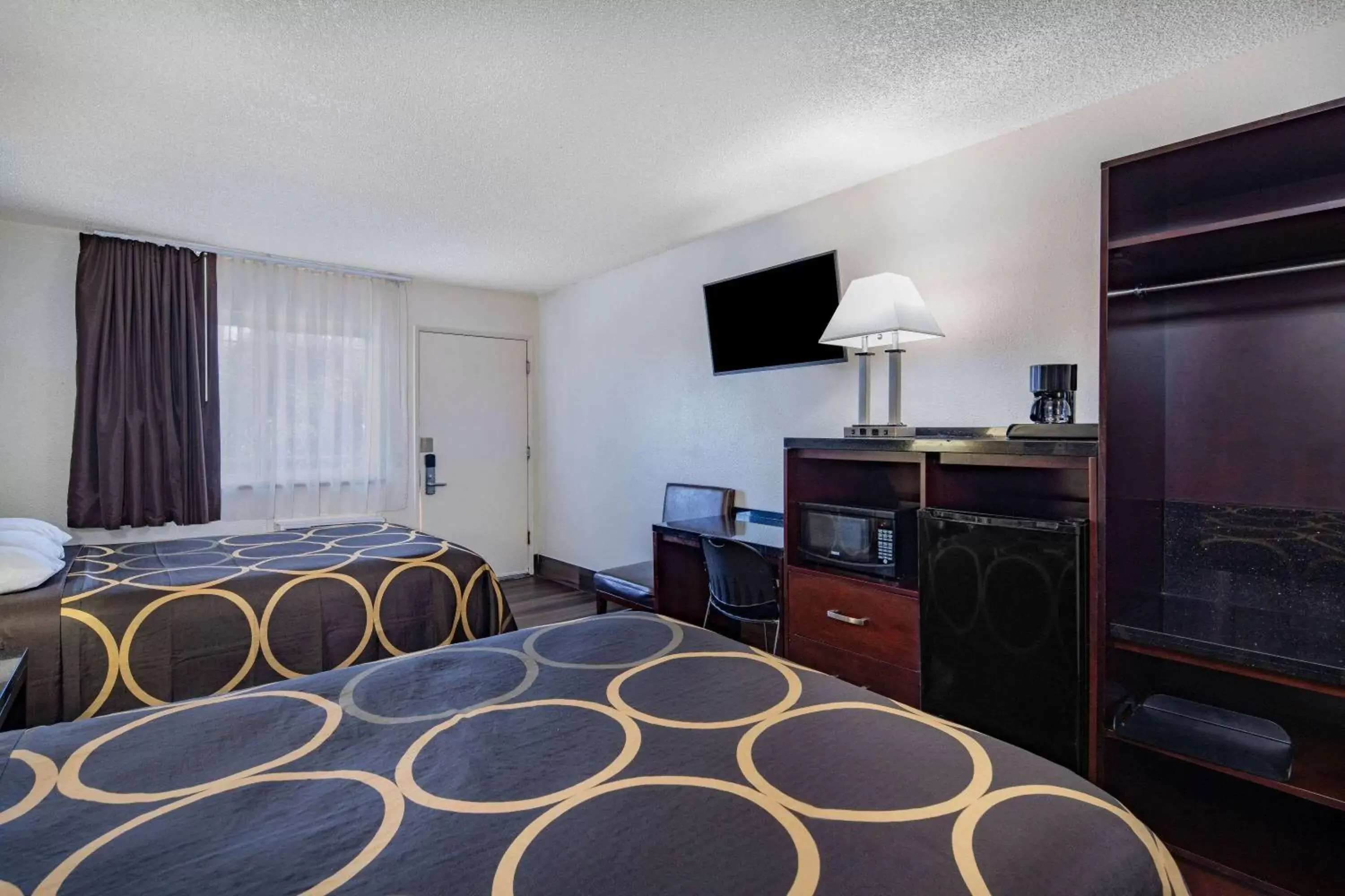 Photo of the whole room, TV/Entertainment Center in Super 8 by Wyndham San Diego Hotel Circle