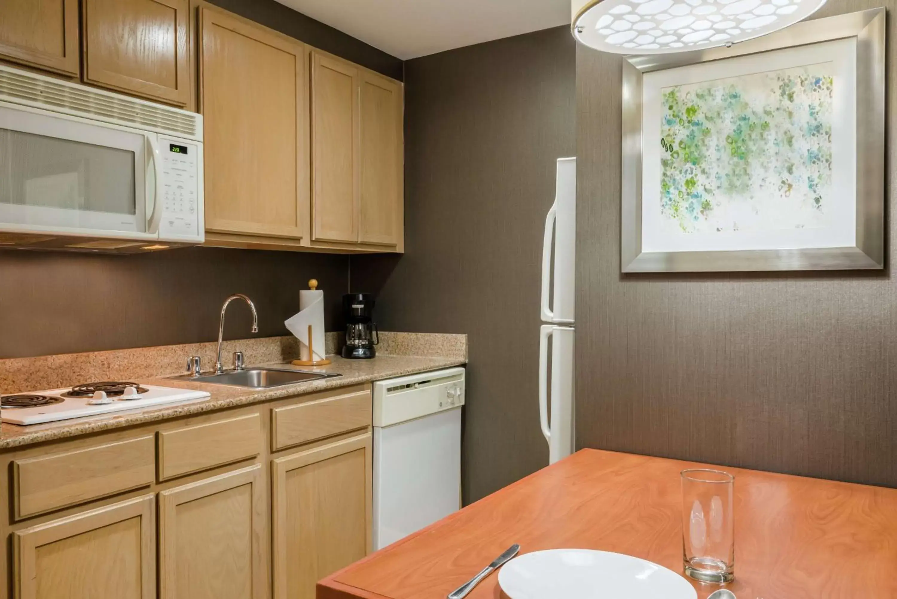 Kitchen or kitchenette, Kitchen/Kitchenette in Homewood Suites by Hilton Orlando-Nearest to Universal Studios