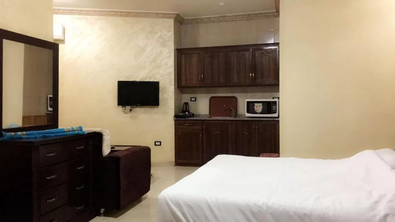 Bed in Al Tawheed Hotel Apartments
