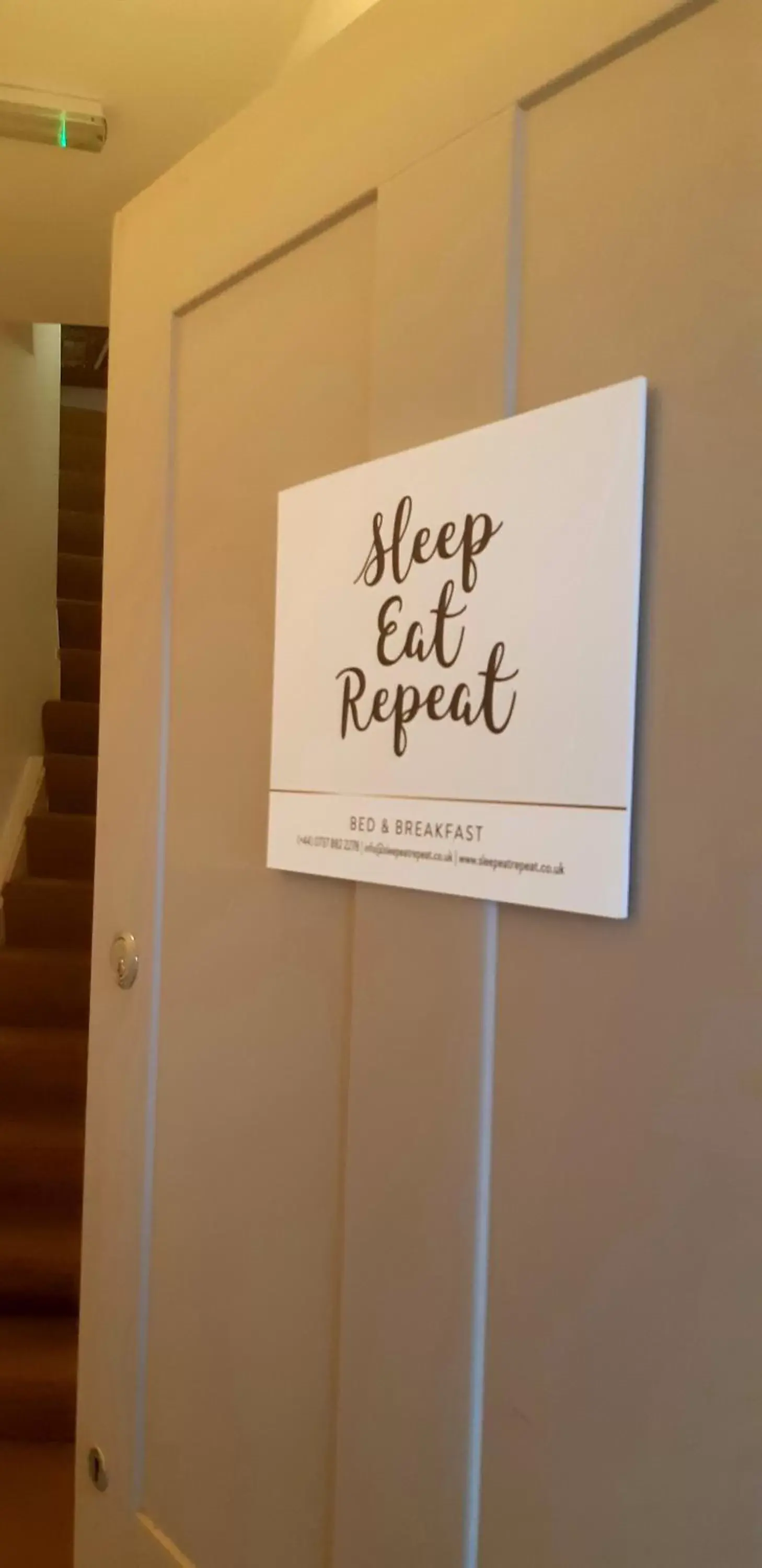 Property logo or sign in Sleep, Eat, Repeat Bed and Breakfast