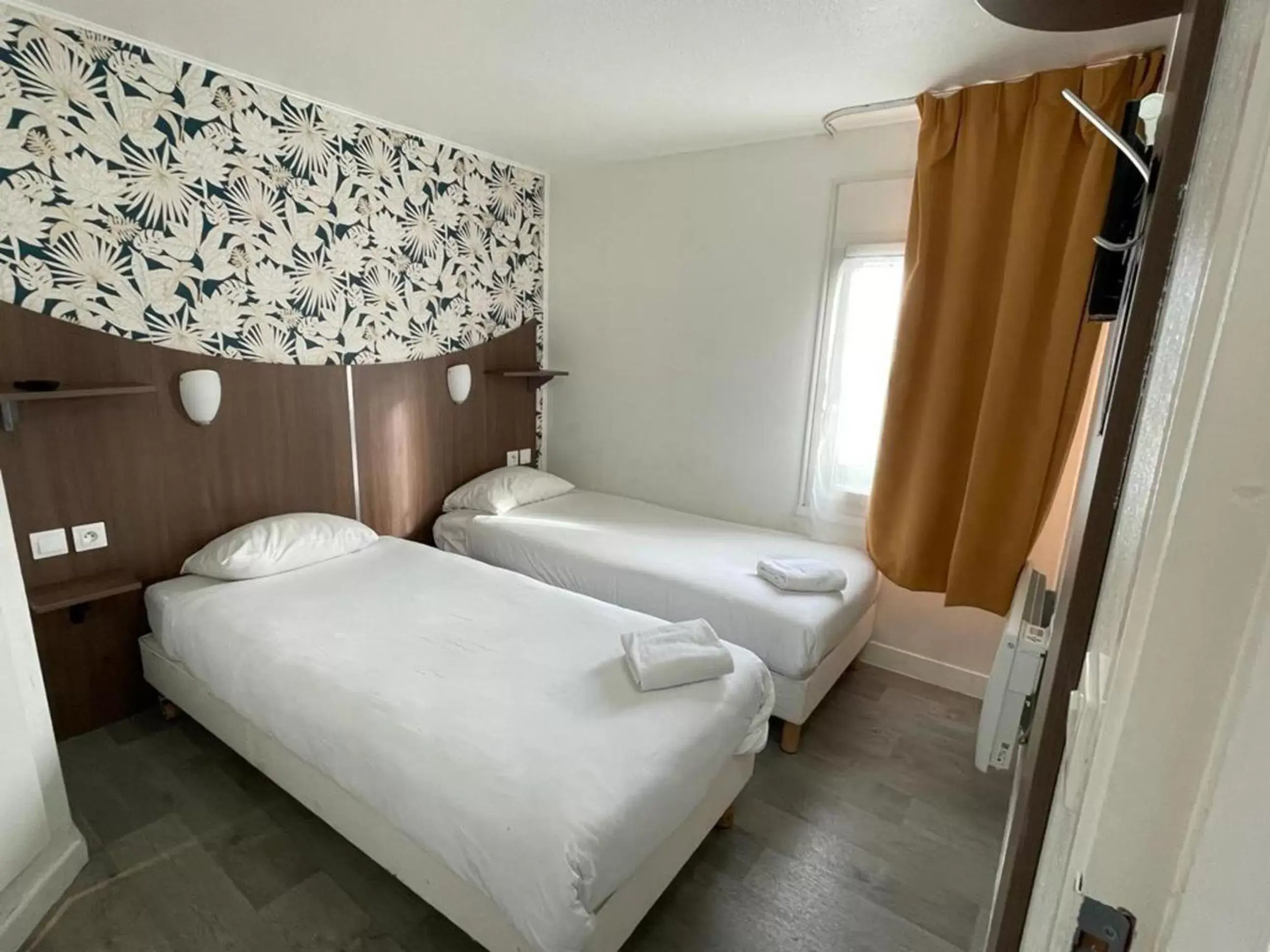 Bed in Kyriad Direct Val de Reuil