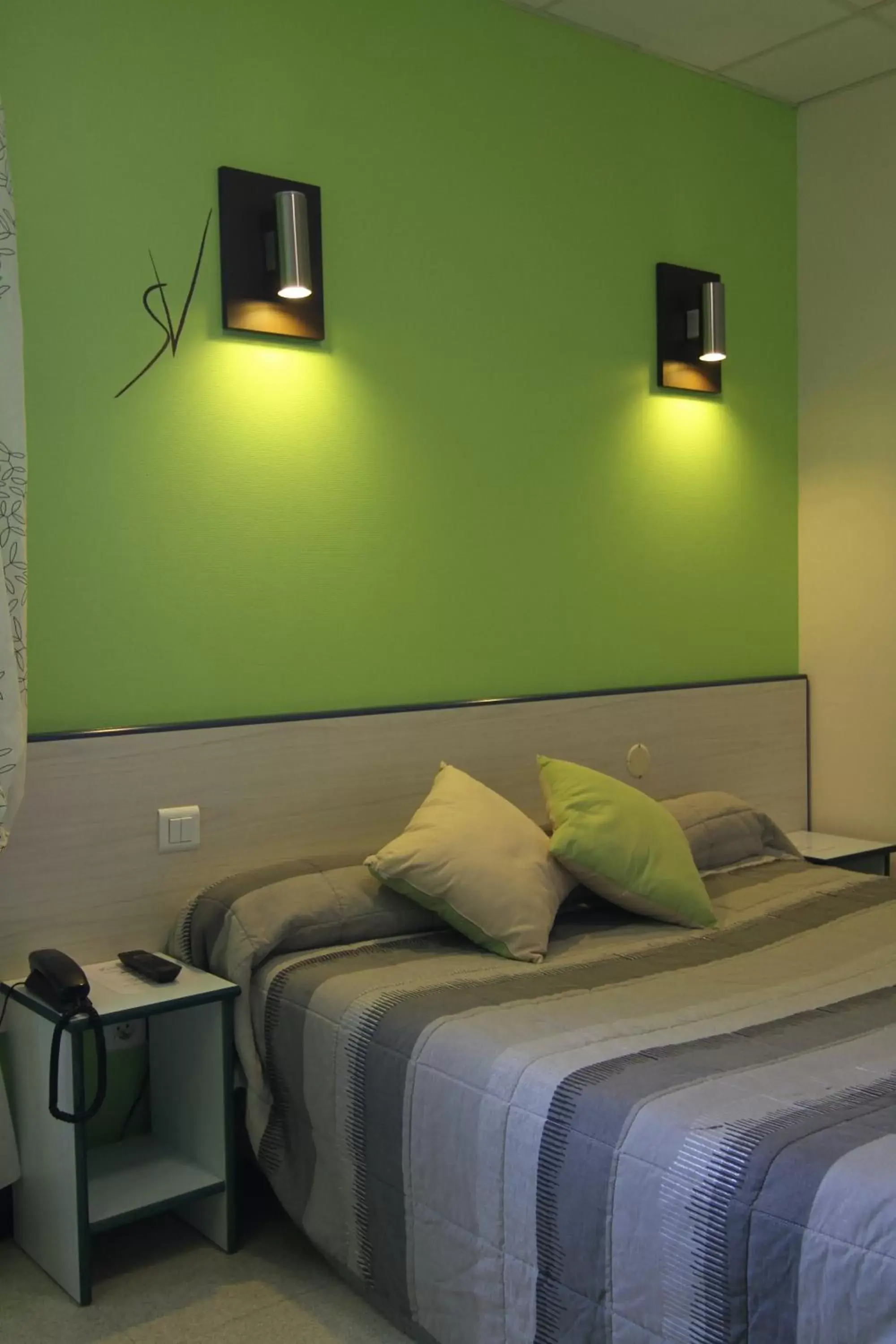 Photo of the whole room, Bed in Hotel Le Saint Vincent Lyon Sud Photo of the whole room, Bed in Hotel Le Saint Vincent Lyon Sud