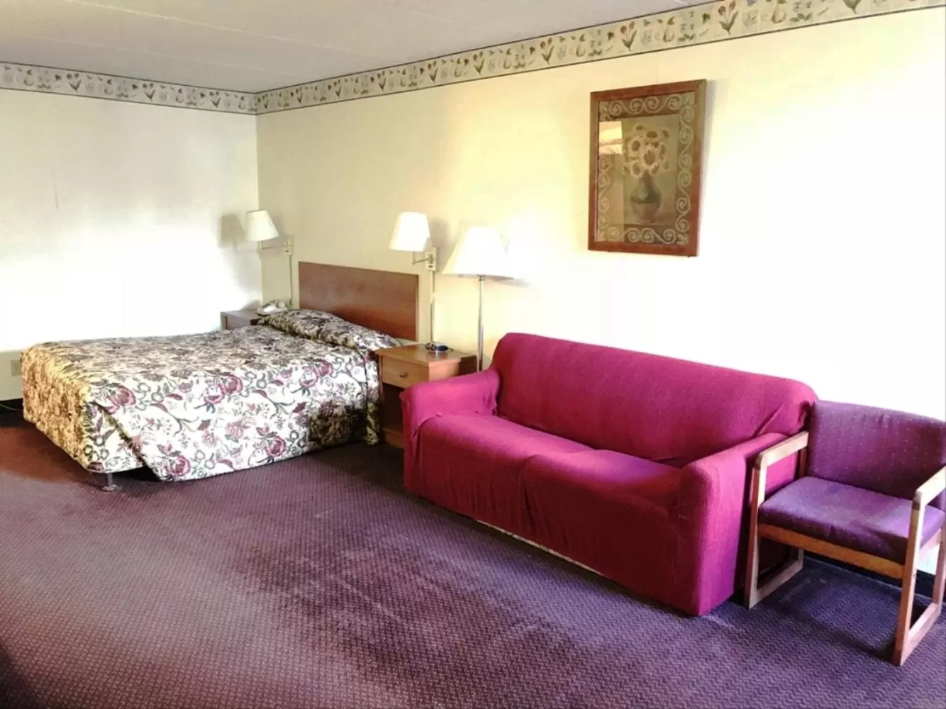 Seating area, Bed in Adirondack Efficiencies