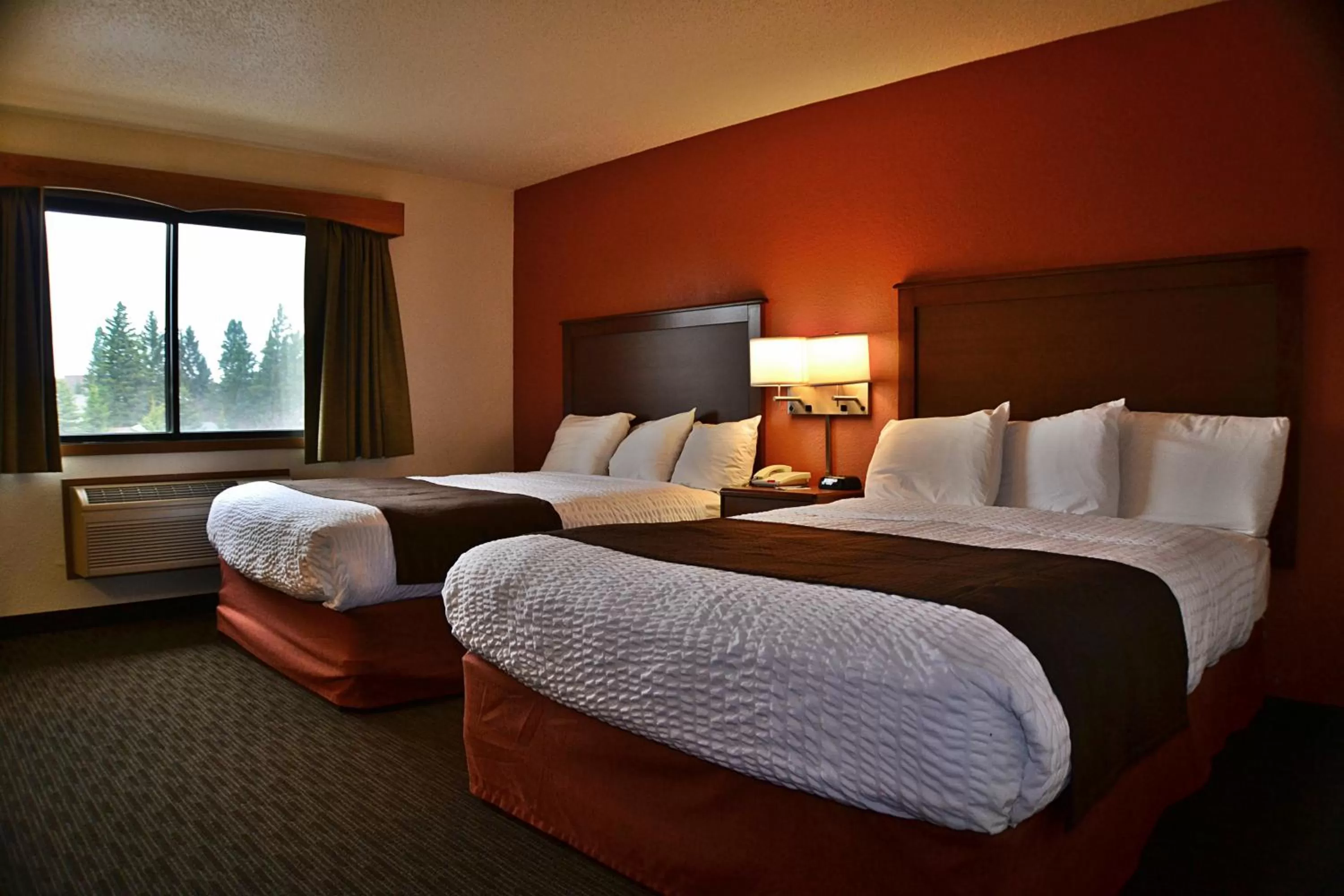 Bed in AmericInn by Wyndham Calumet