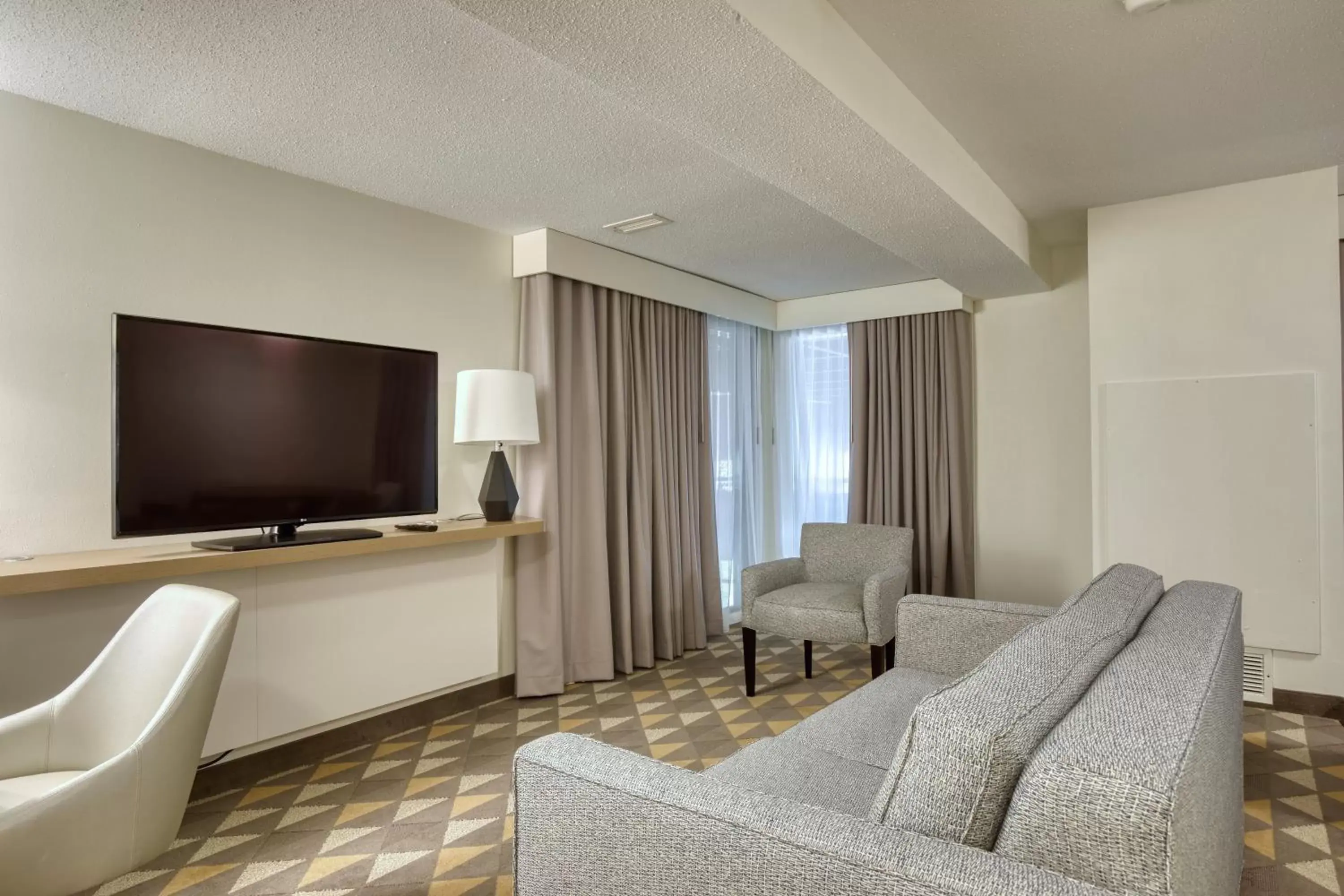 Photo of the whole room, TV/Entertainment Center in Holiday Inn Hotel & Suites Madison West, an IHG Hotel