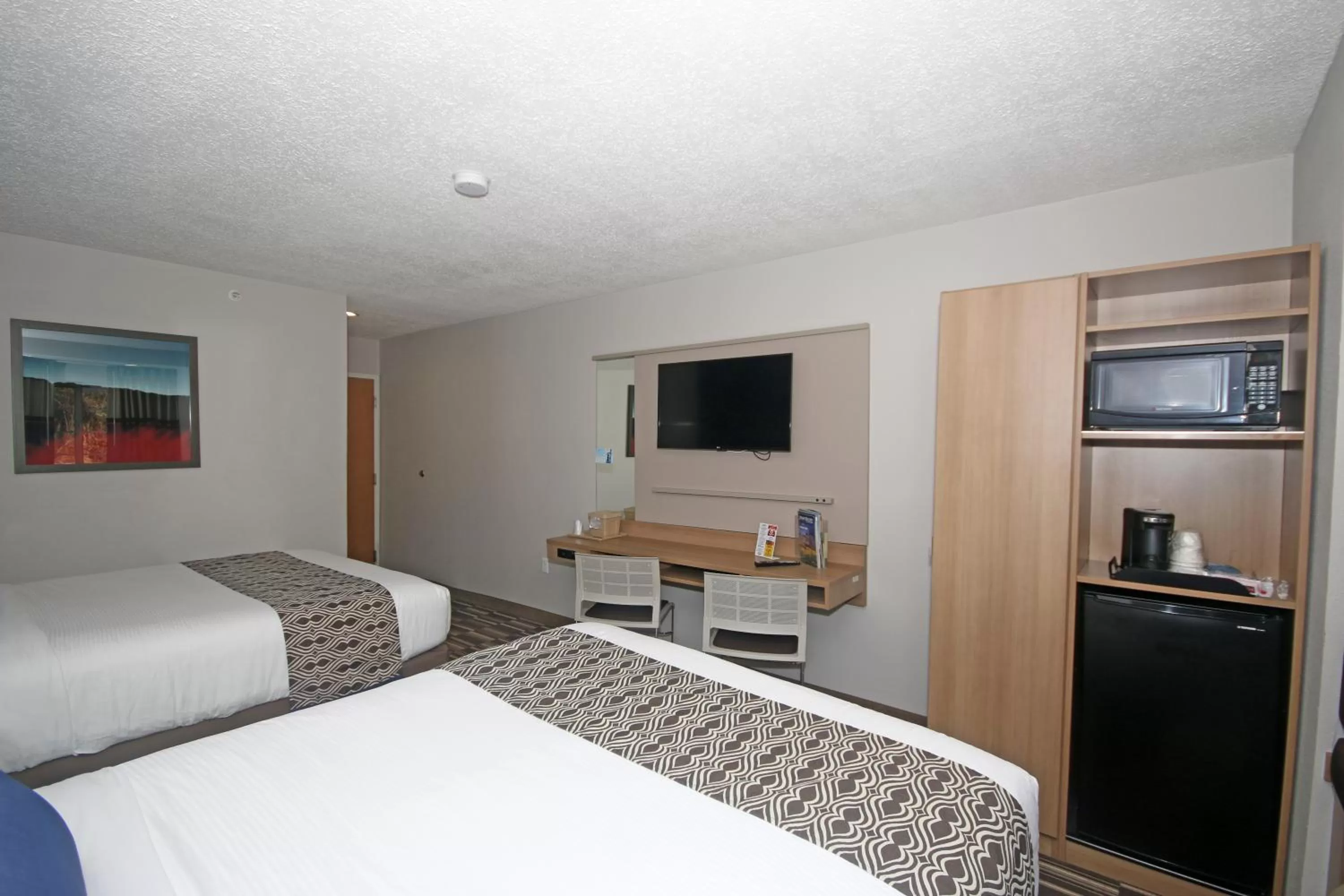 Photo of the whole room, Bed in Microtel Inn by Wyndham Greensboro