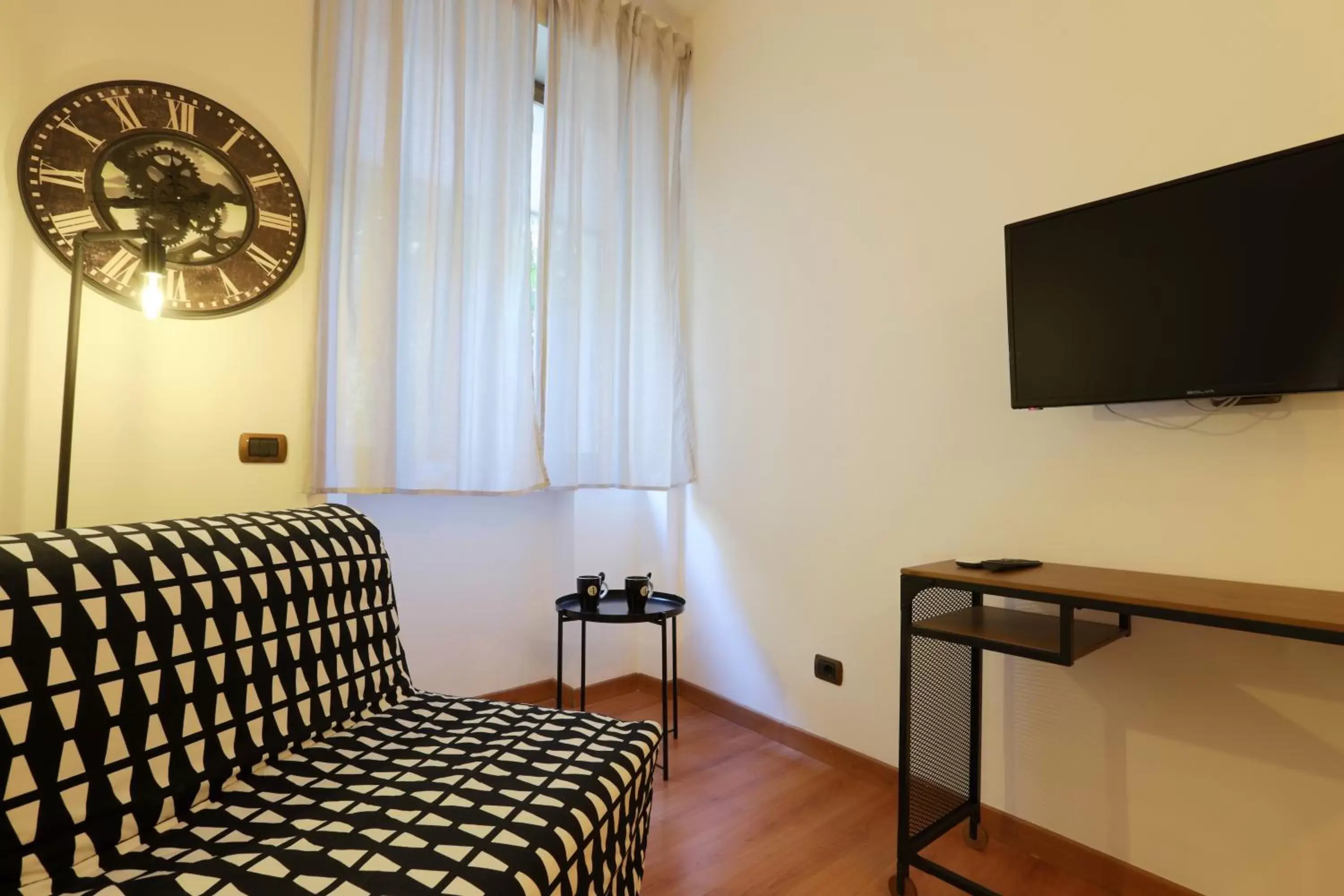 Photo of the whole room, TV/Entertainment Center in Napoli Vesuvio Apartments by Dimorra
