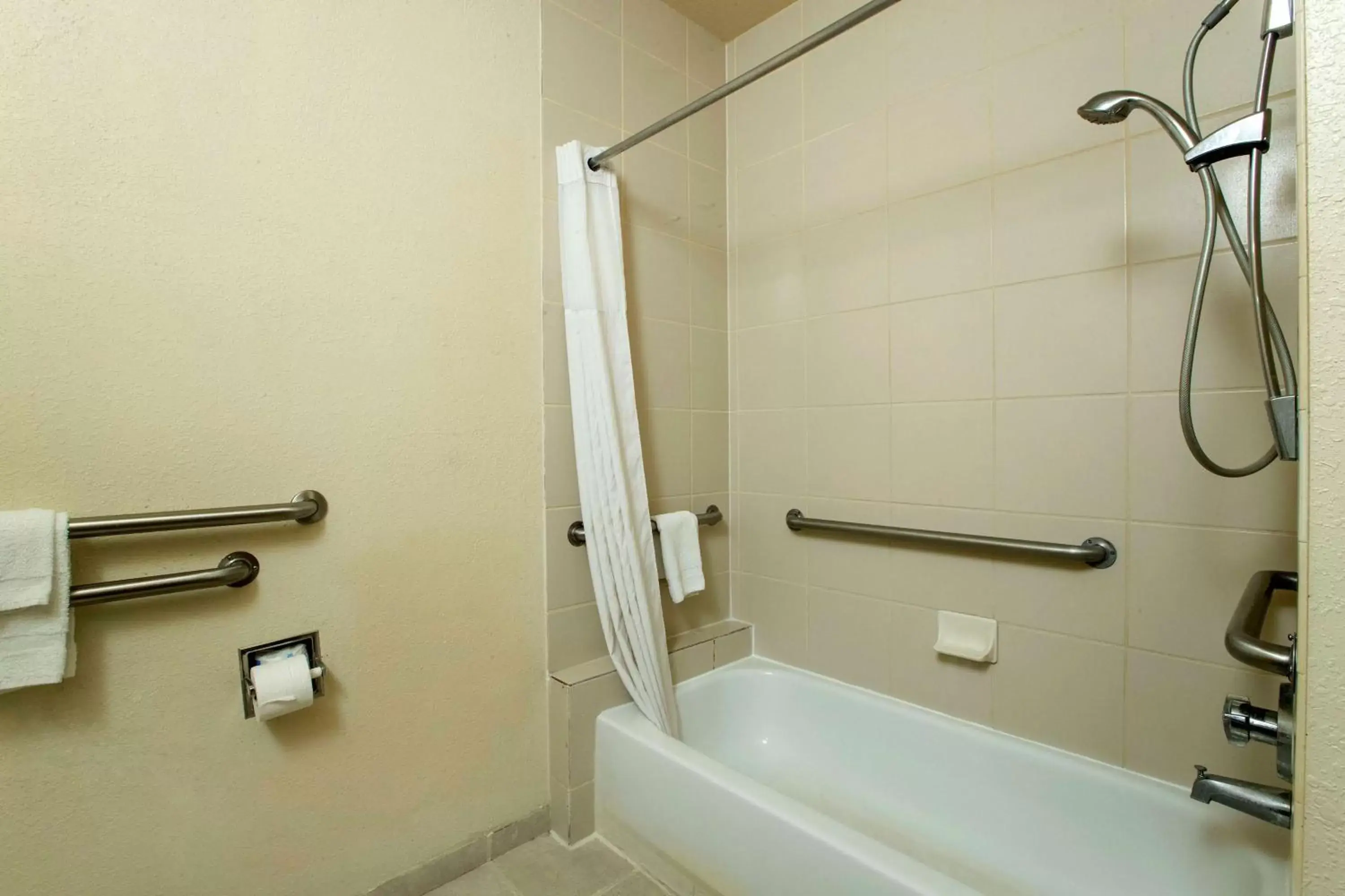 Bathroom in Days Inn & Suites by Wyndham Houston North/Aldine