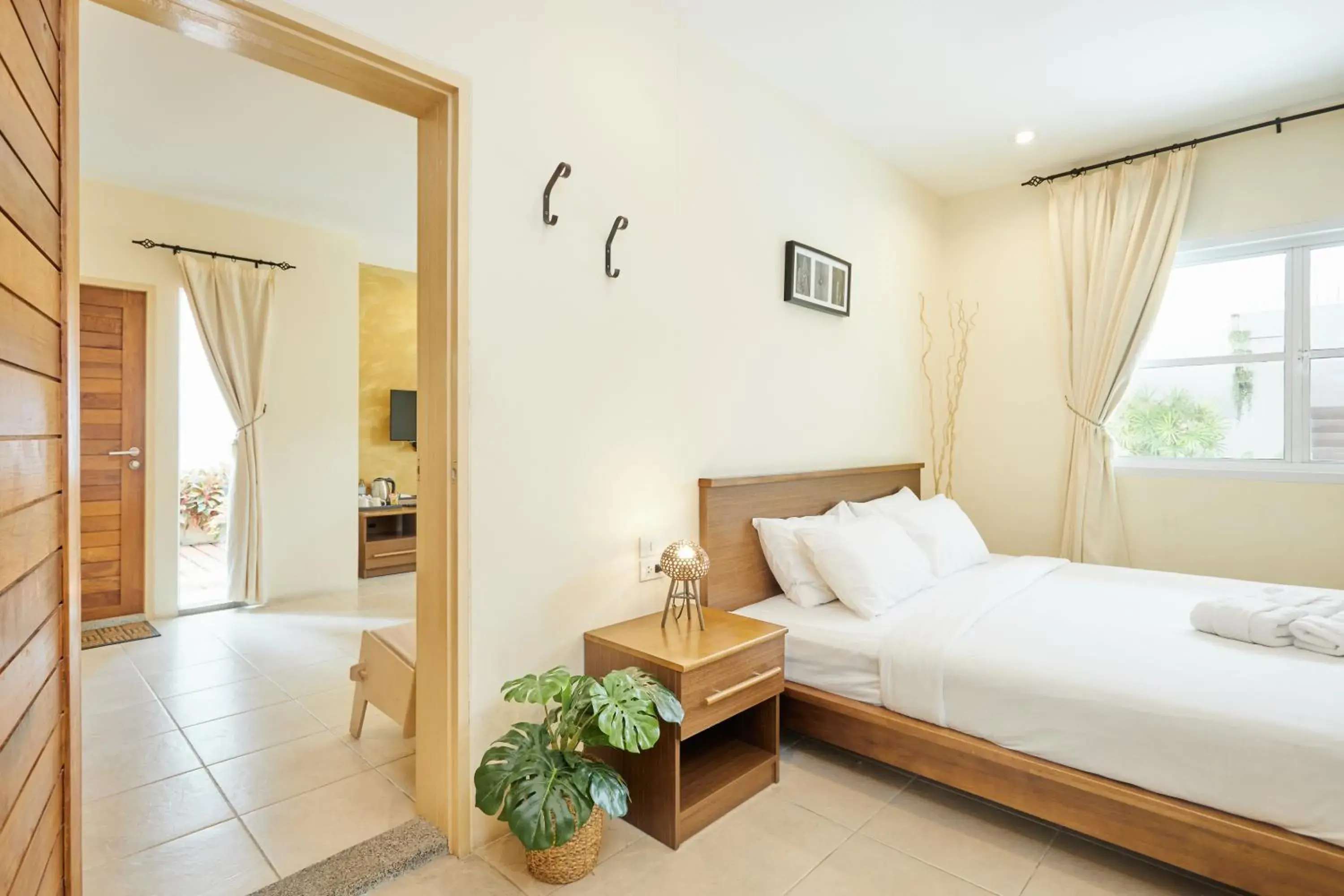 Bed in Talay Hotel & Villa