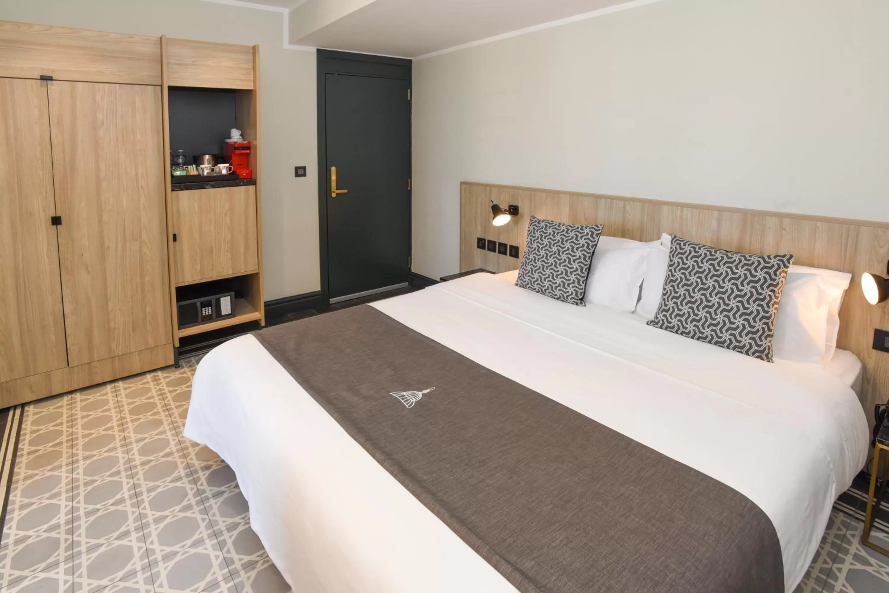 Bed in La Falconeria Hotel