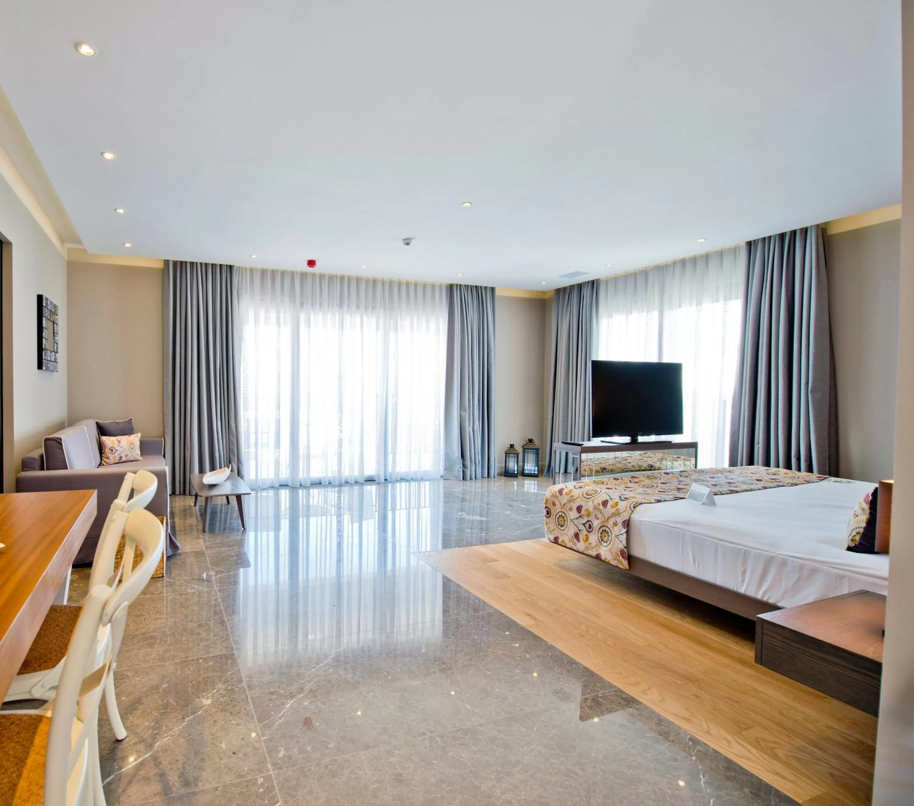 Living room, Bed in Ramada Resort by Wyndham Bodrum