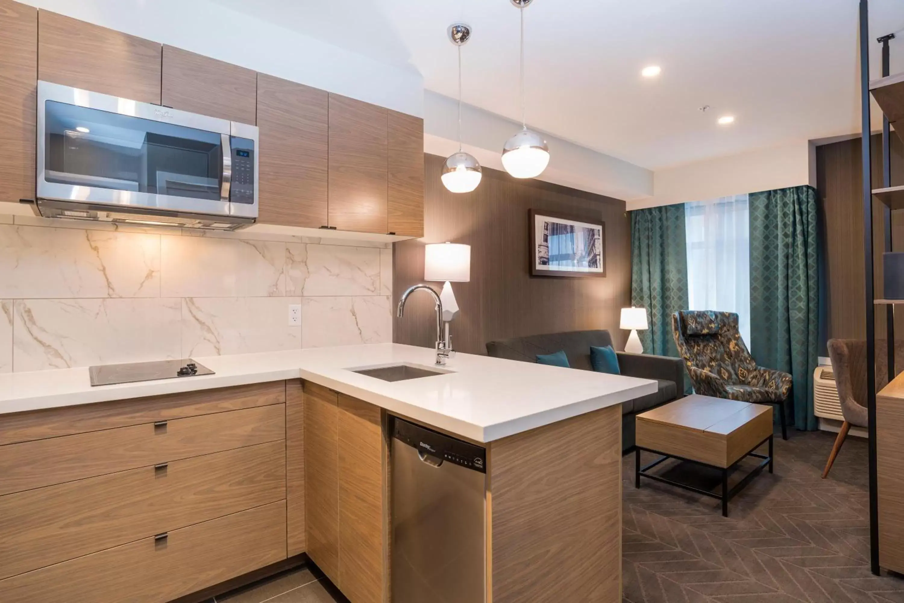 Photo of the whole room, Kitchen/Kitchenette in Sandman Signature Calgary Airport Hotel