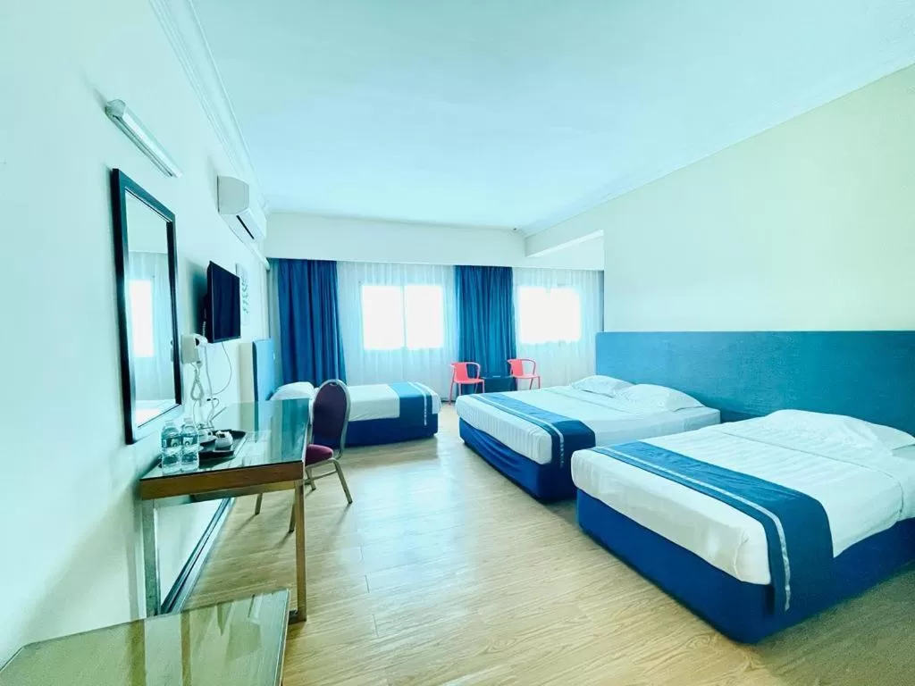 Bed in Tyng Garden Hotel