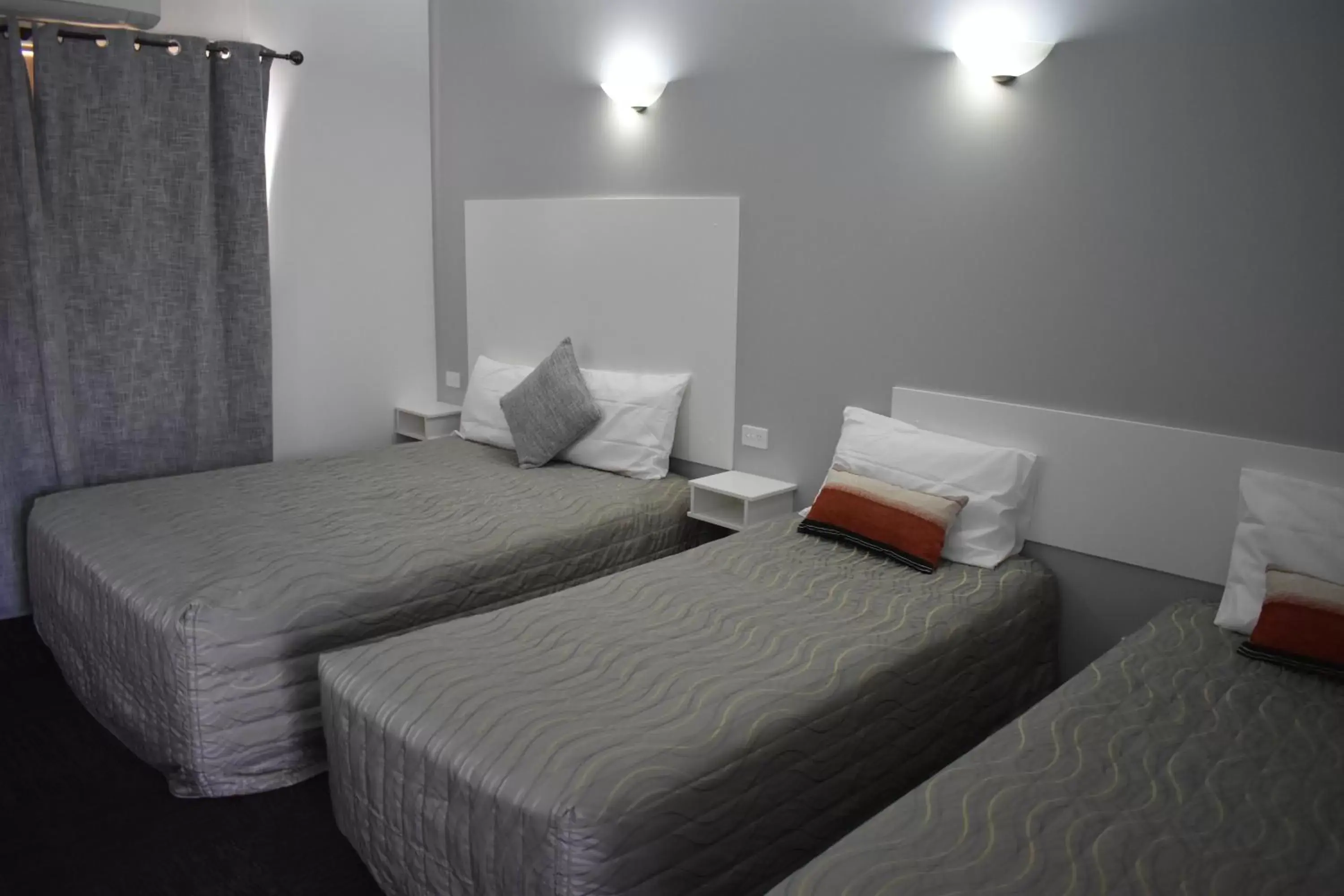 Bed in Riviana Motel