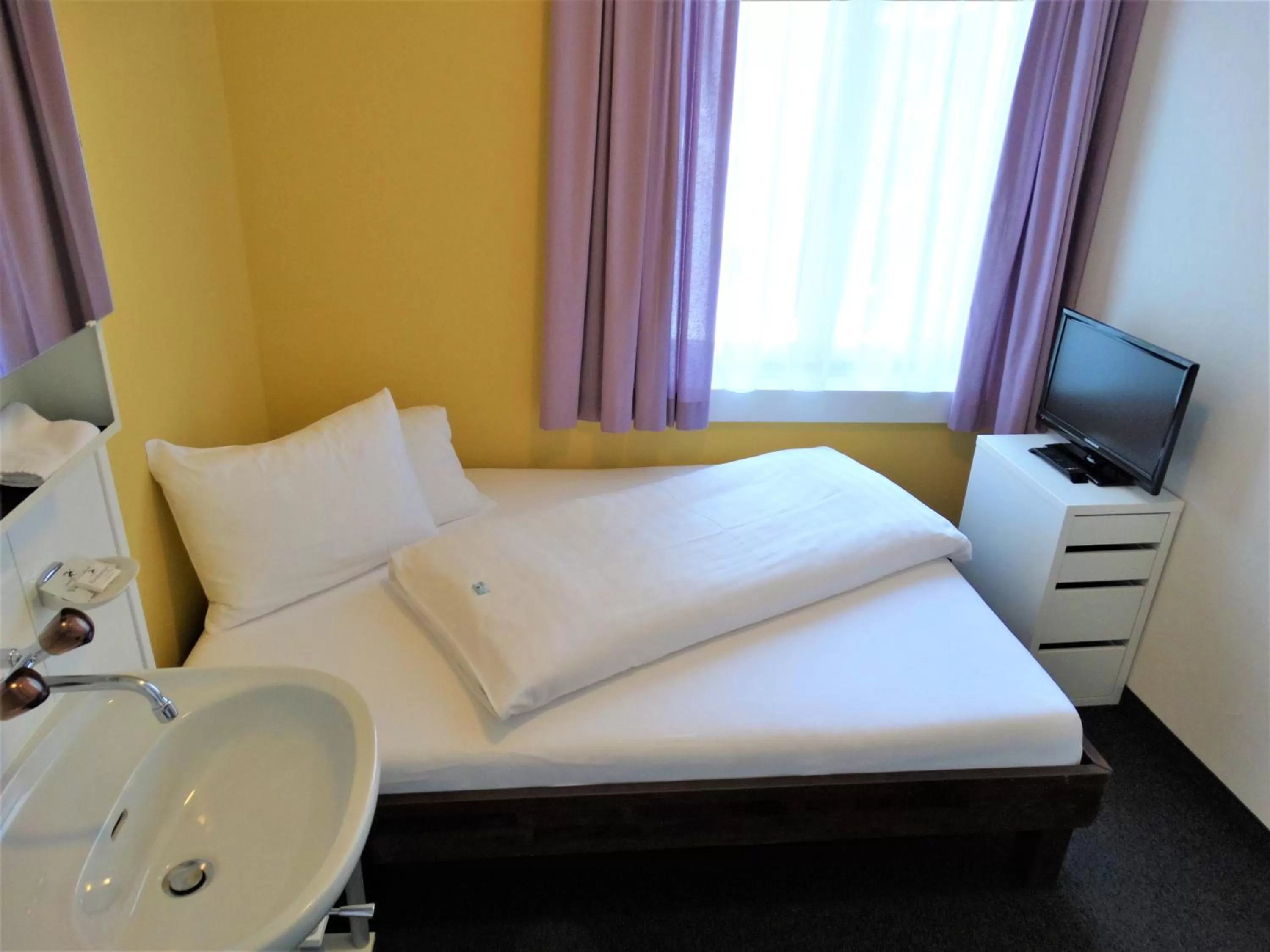 Bed in Hotel Bündnerhof