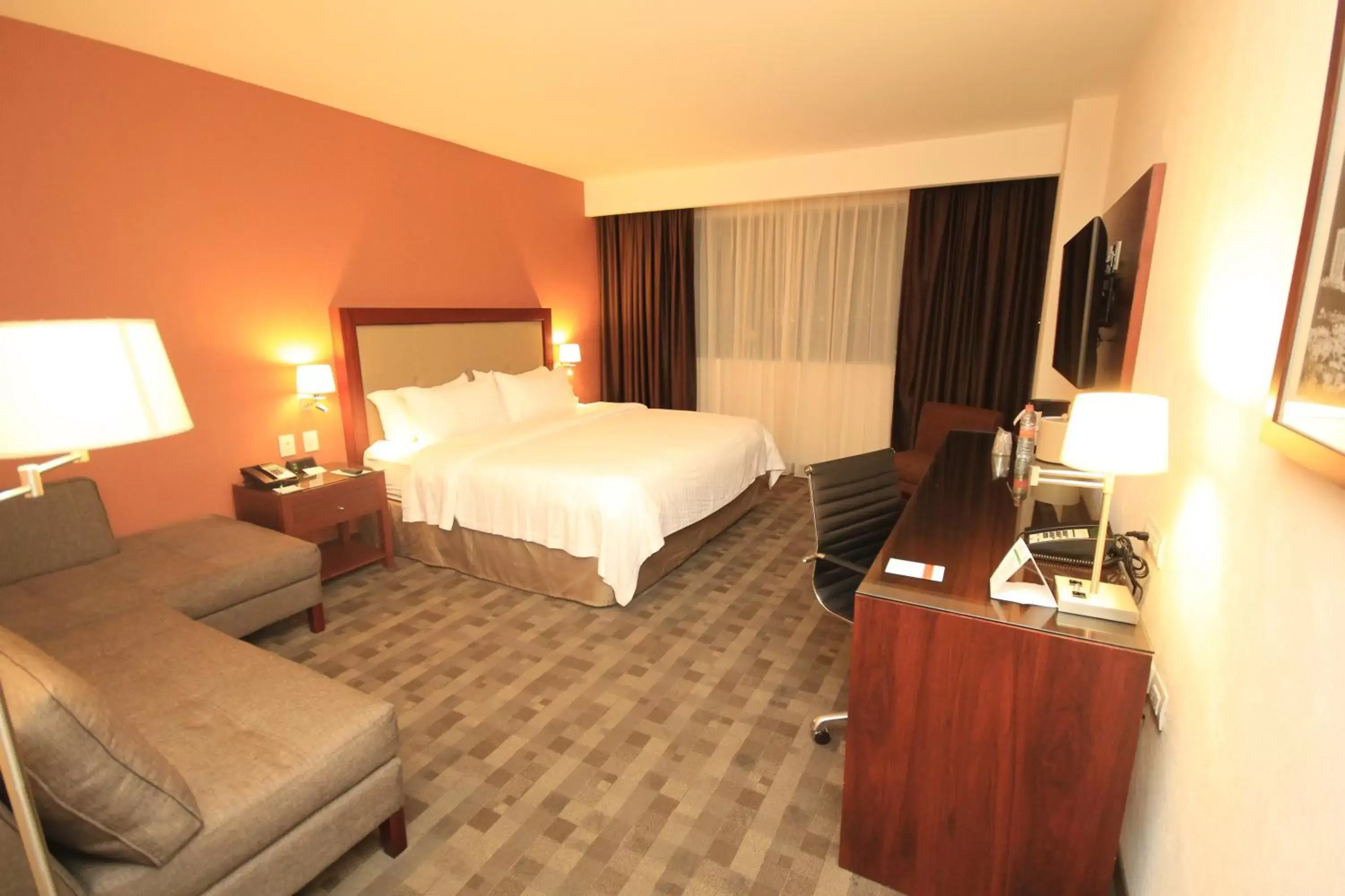 Photo of the whole room, Bed in Holiday Inn & Suites Plaza Mayor, an IHG Hotel