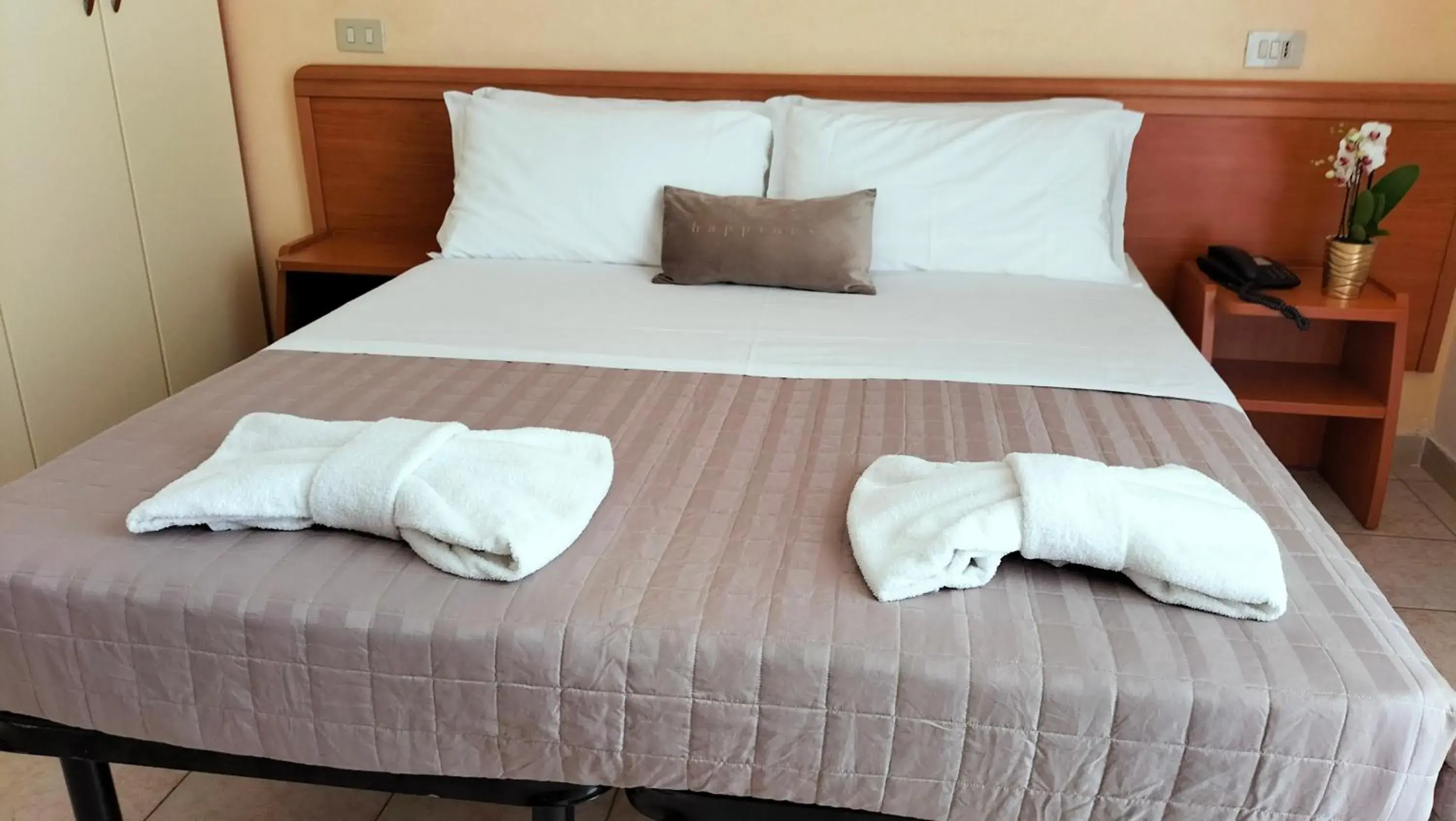 Bed in Aura Living Hotel