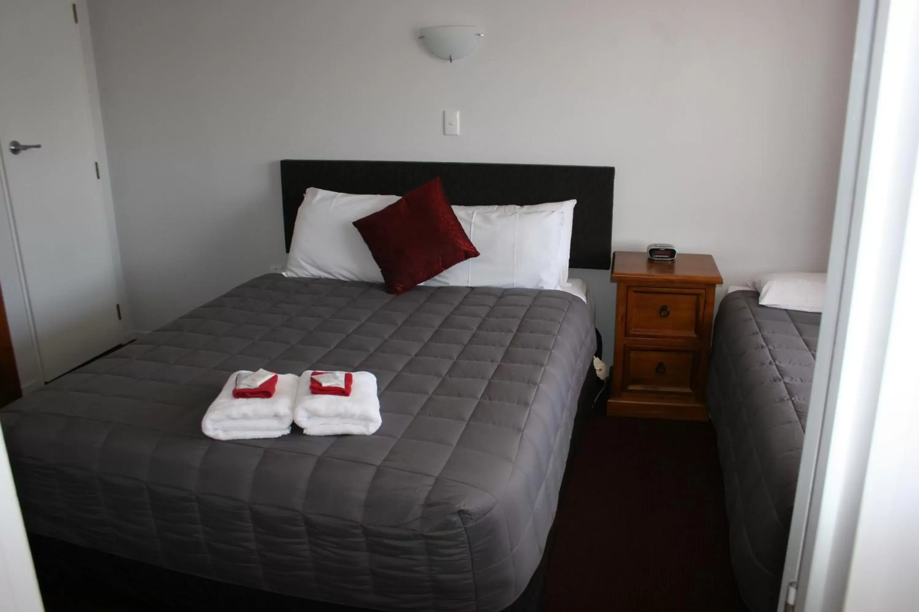 Bed in Burgundy Rose Motel