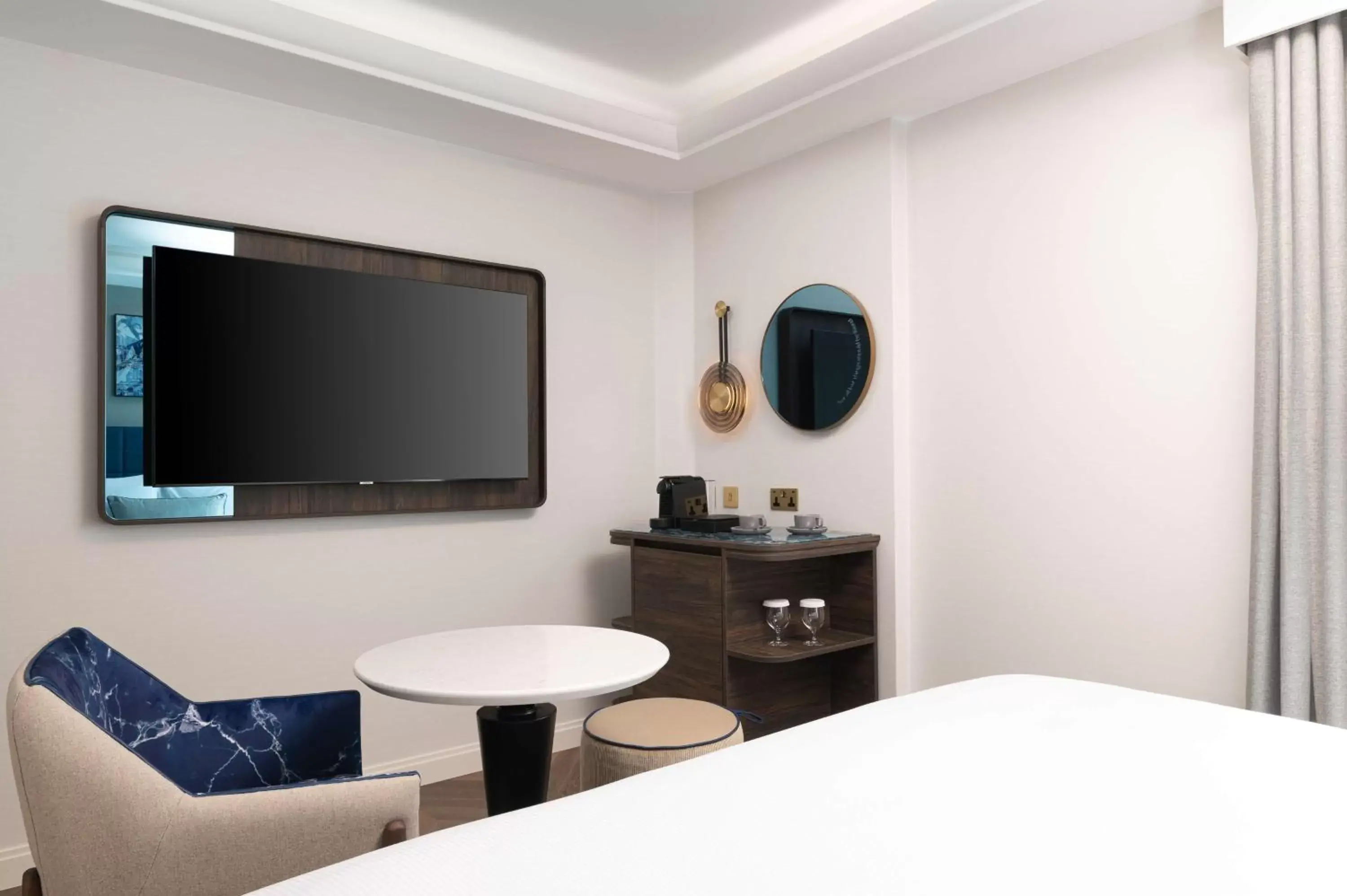 Bed, TV/Entertainment Center in Lost Property St Pauls London, Curio Collection By Hilton