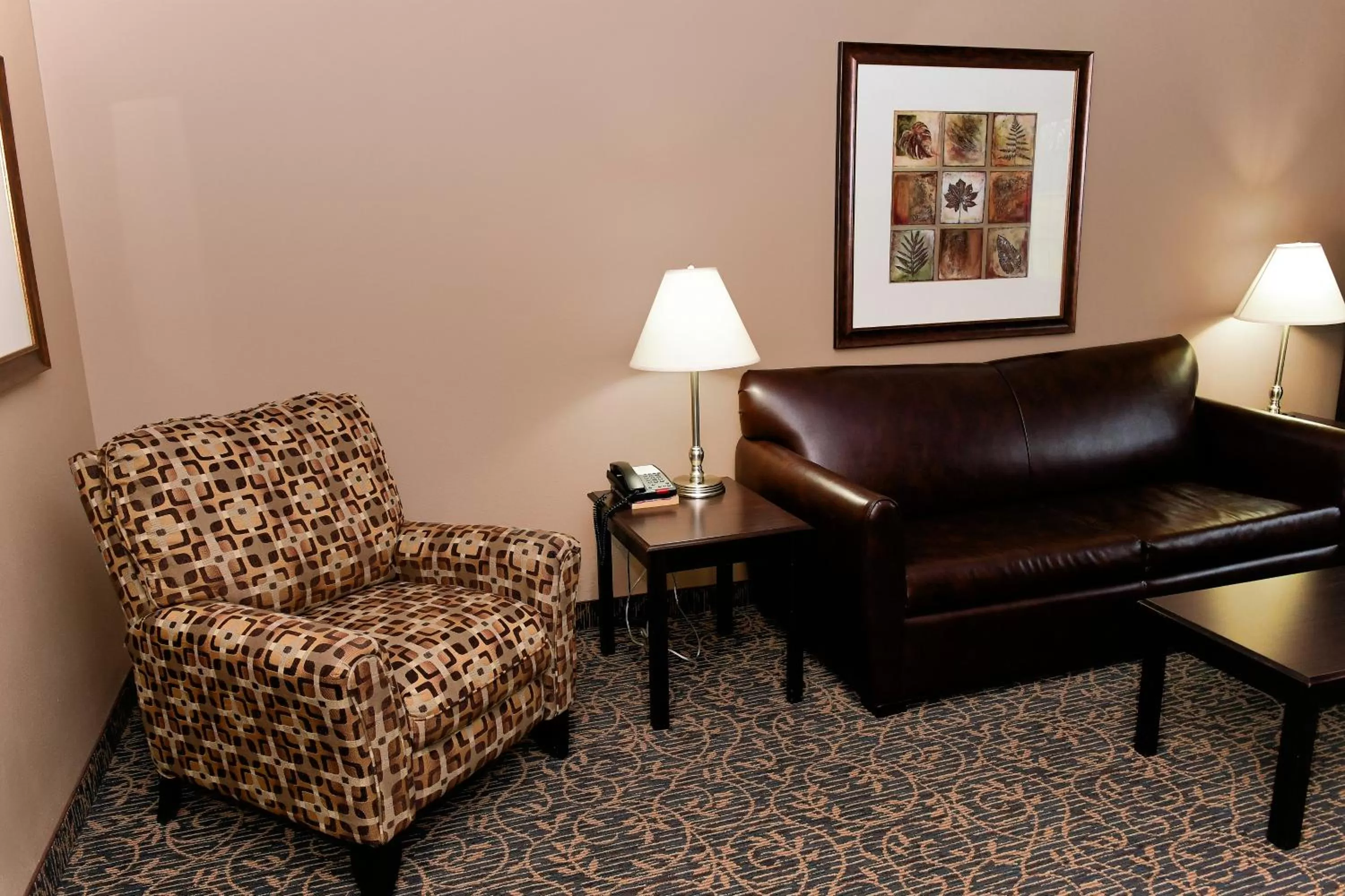 Living room in Cobblestone Inn & Suites - Denison | Majestic Hills