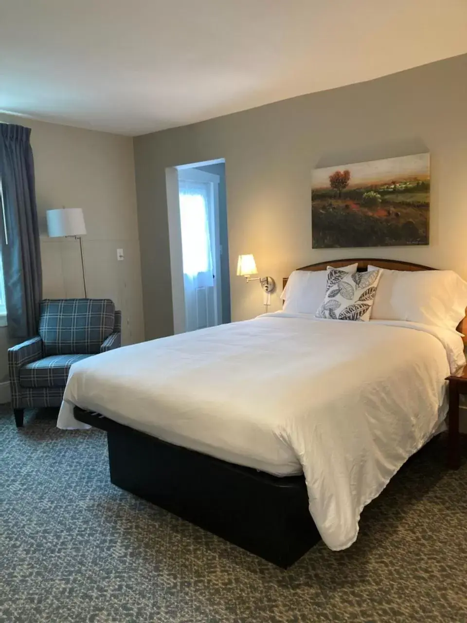 Bed in Country Squire Inn and Suites