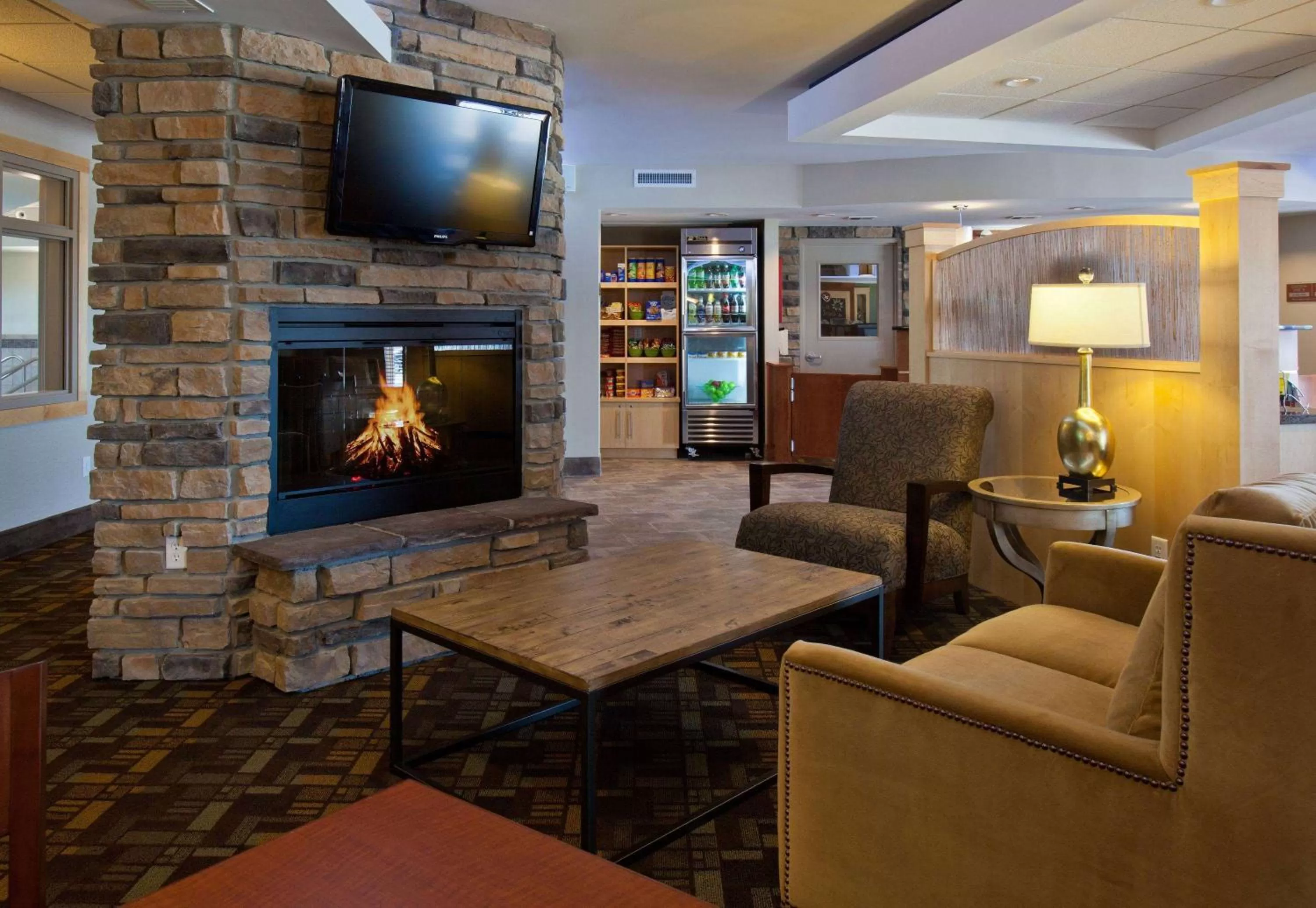 Seating area in AmericInn by Wyndham Fairfield