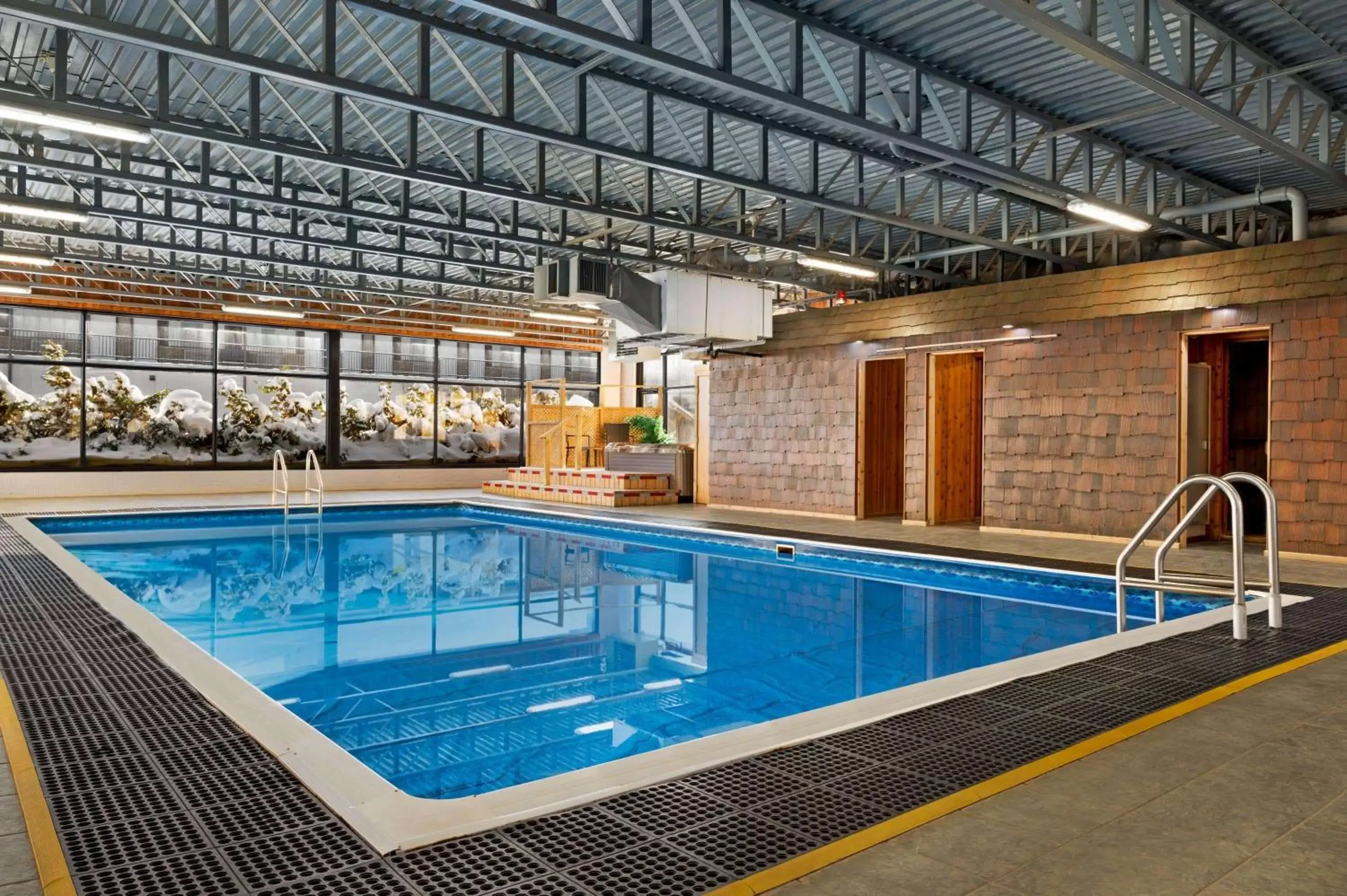 On site, Swimming Pool in Super 8 by Wyndham Hearst ON