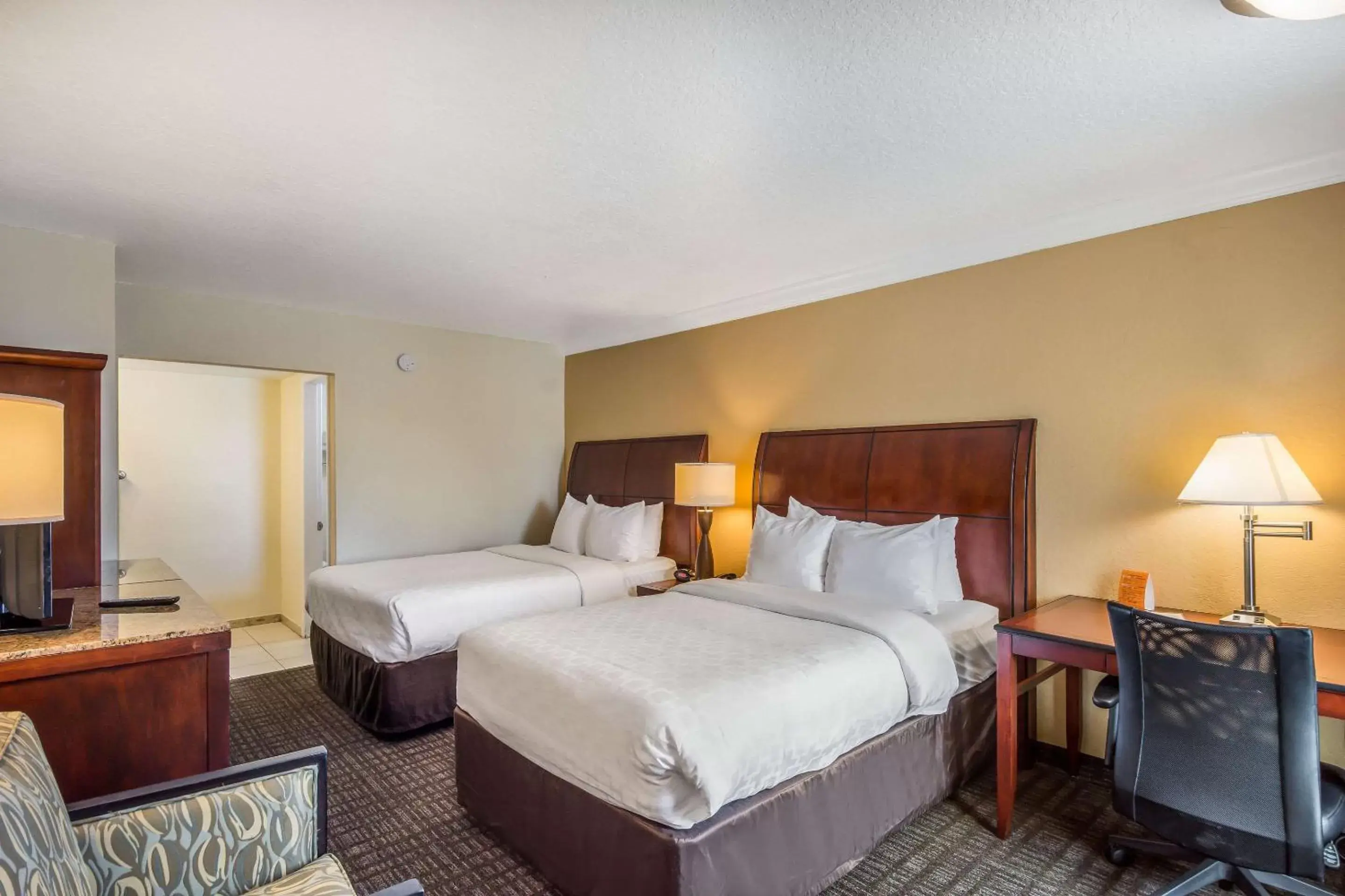 Photo of the whole room, Bed in Clarion Inn & Suites Central Clearwater Beach