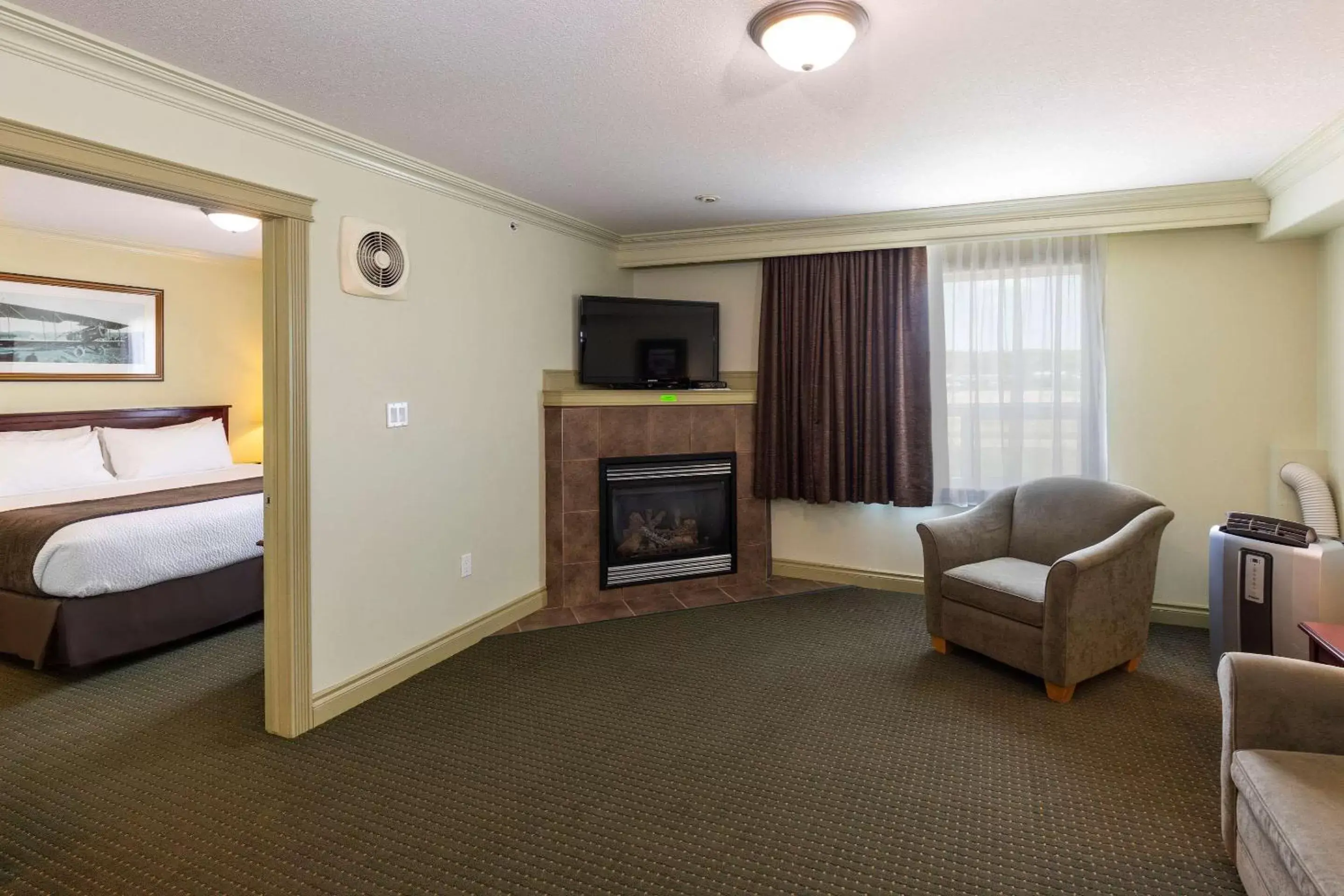 Bedroom, Seating Area in Quality Inn & Suites