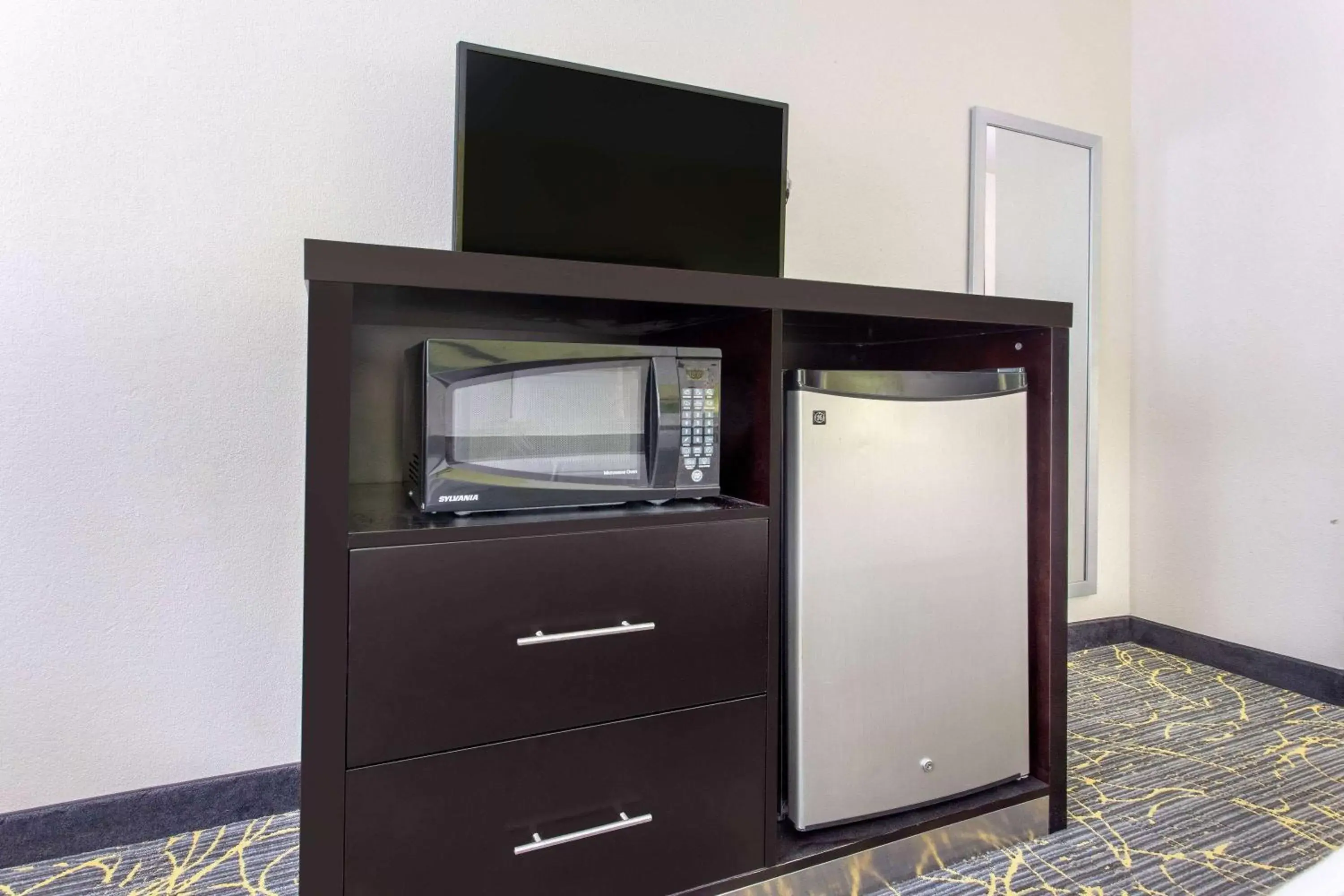 Photo of the whole room, TV/Entertainment Center in AmericInn by Wyndham Delafield