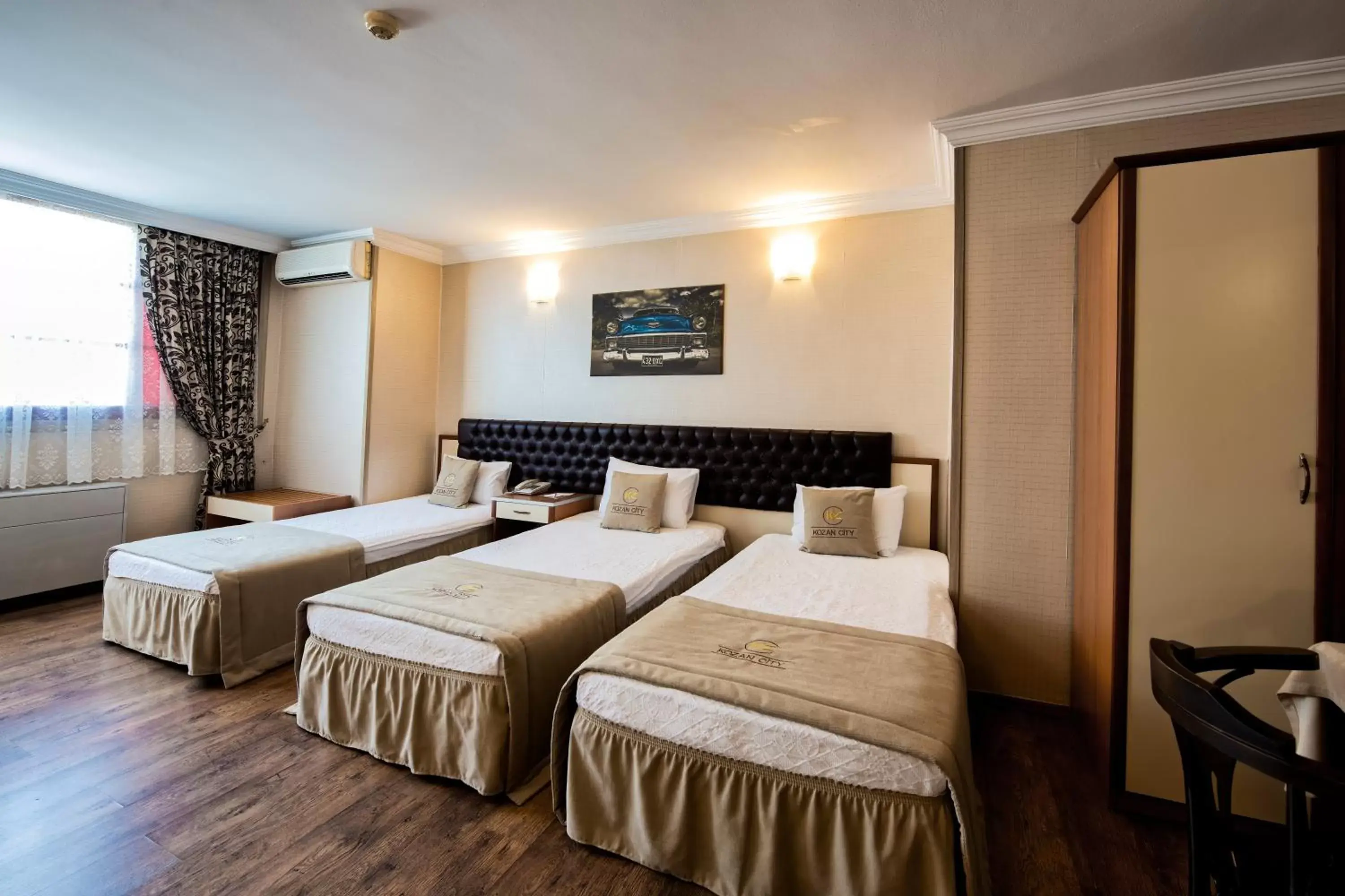 Bed in Kozan City Hotel