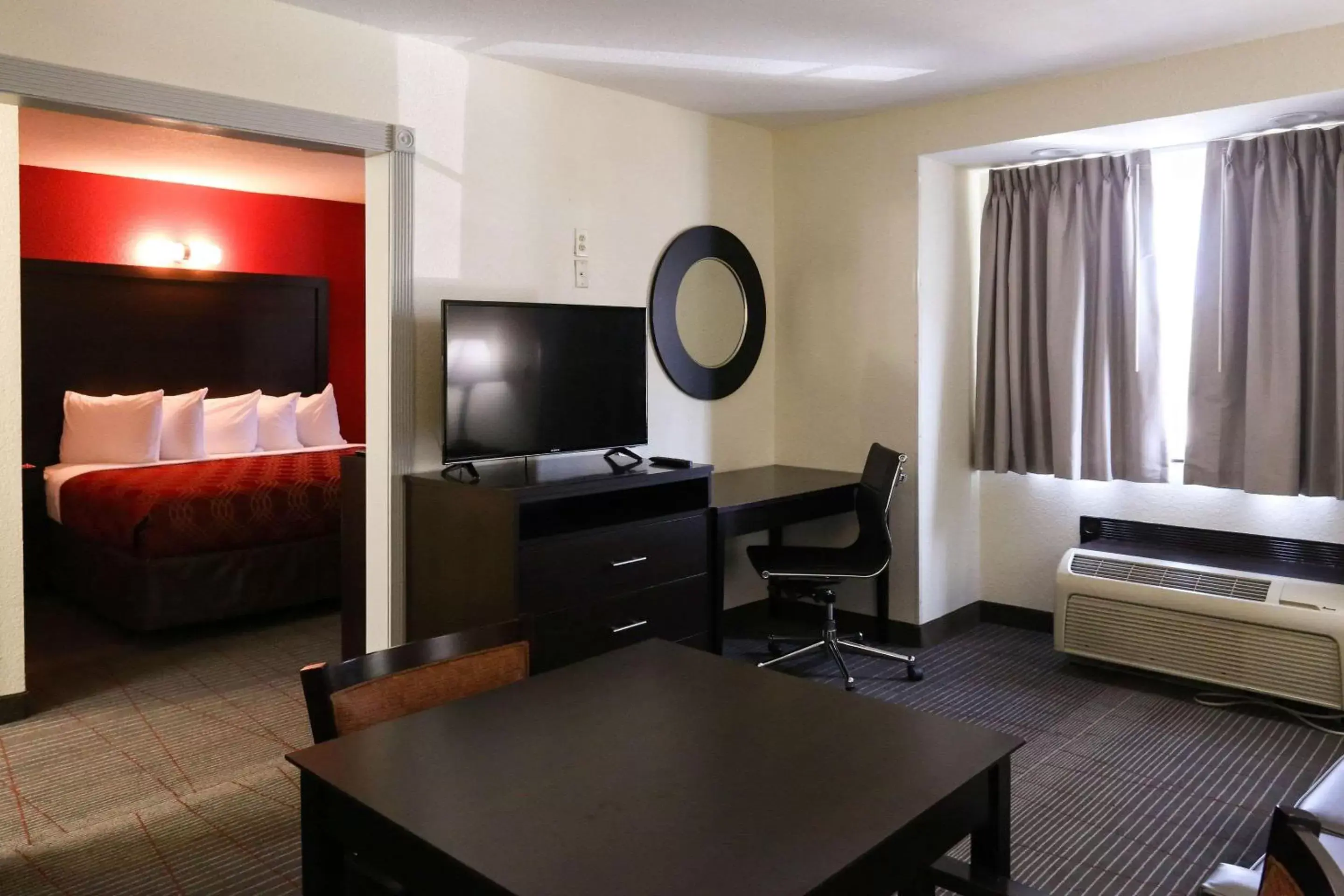 Photo of the whole room, TV/Entertainment Center in Econo Lodge Inn and Suites Greenville
