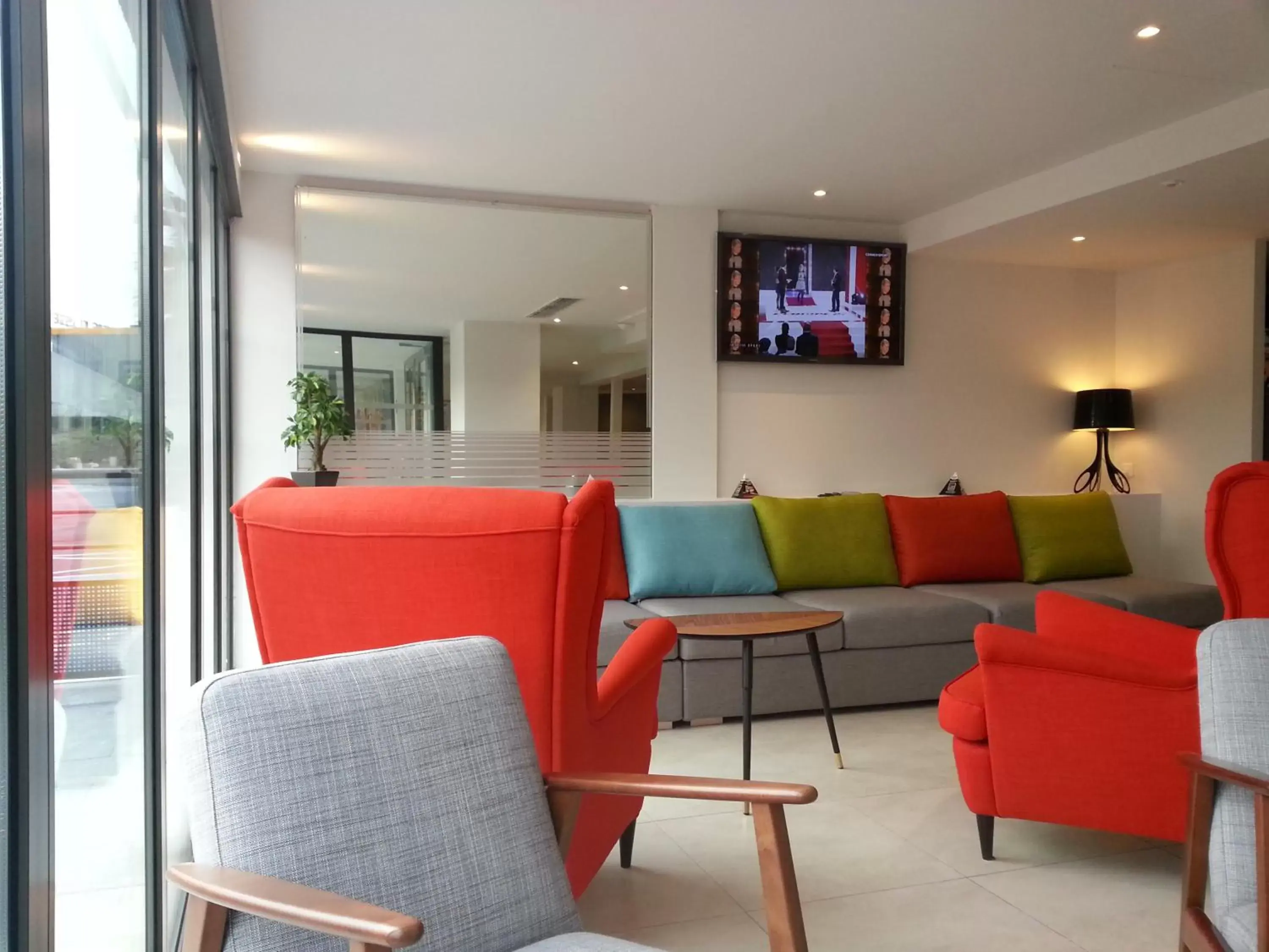 Communal lounge/ TV room, Seating Area in Brit Hotel Porte d'Espagne