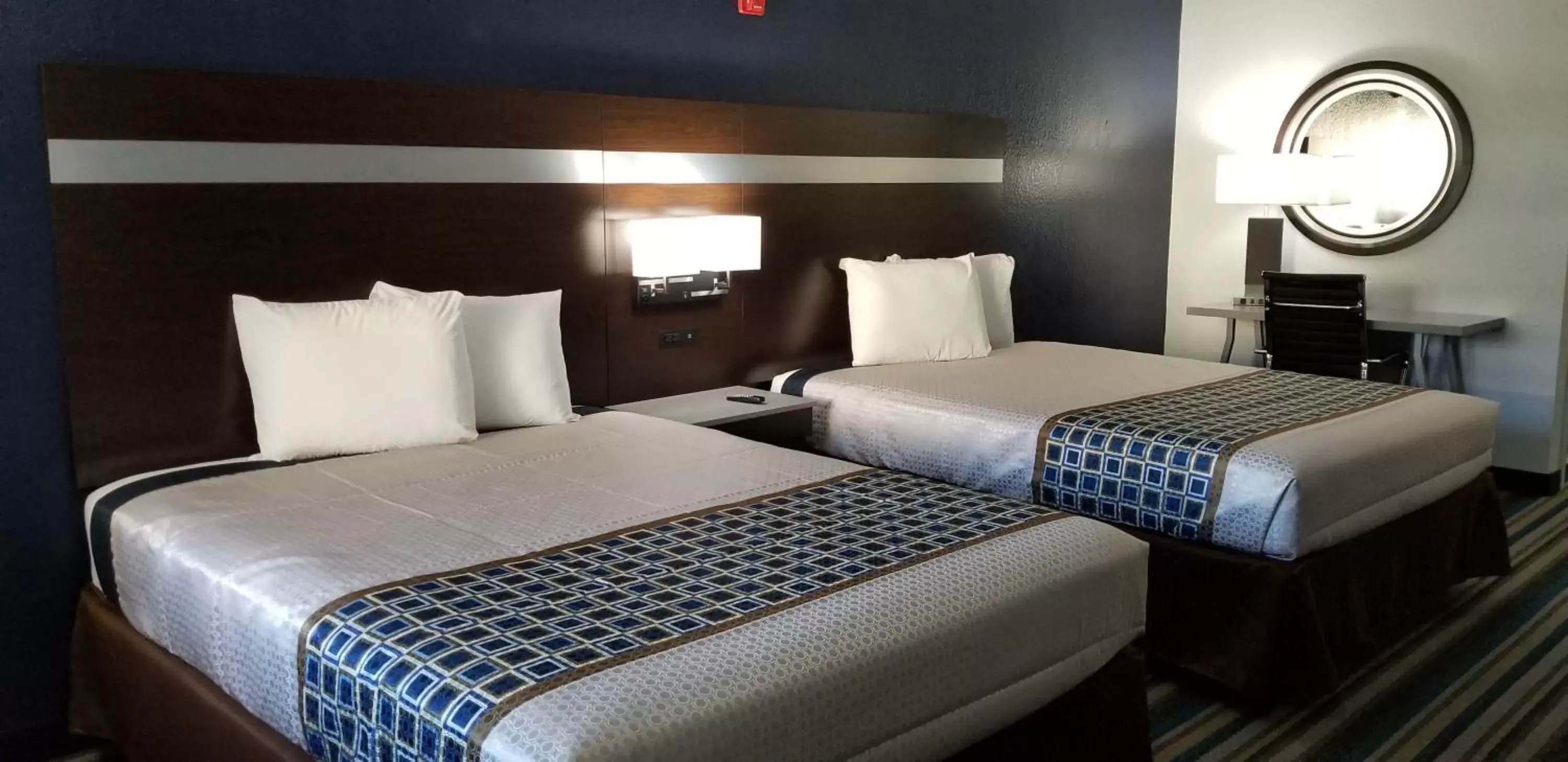 Bed in HomeBridge Inn and Suites