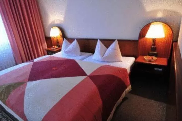 Bed in Hotel Luginsland