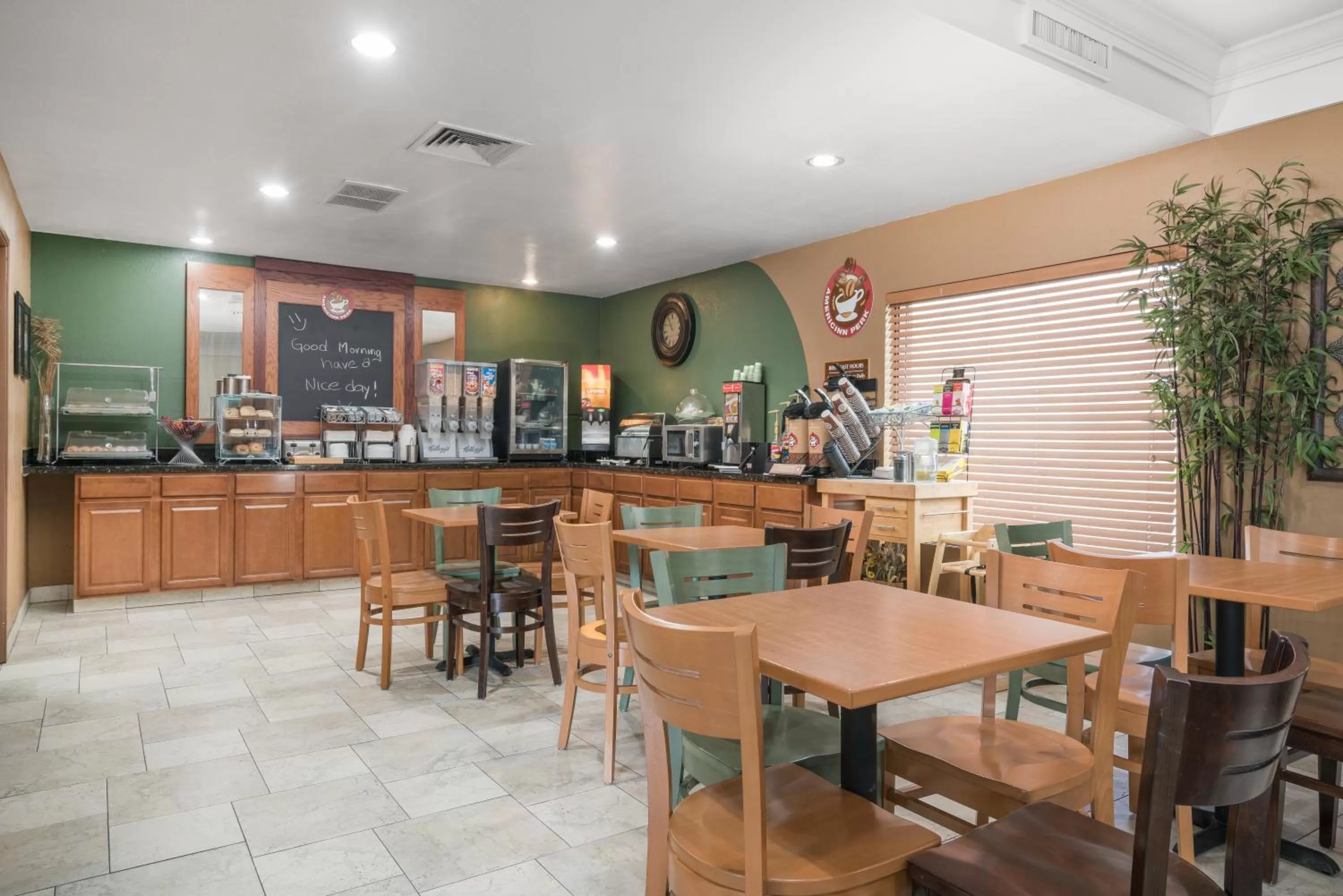 Dining area in AmericInn by Wyndham Johnston Des Moines