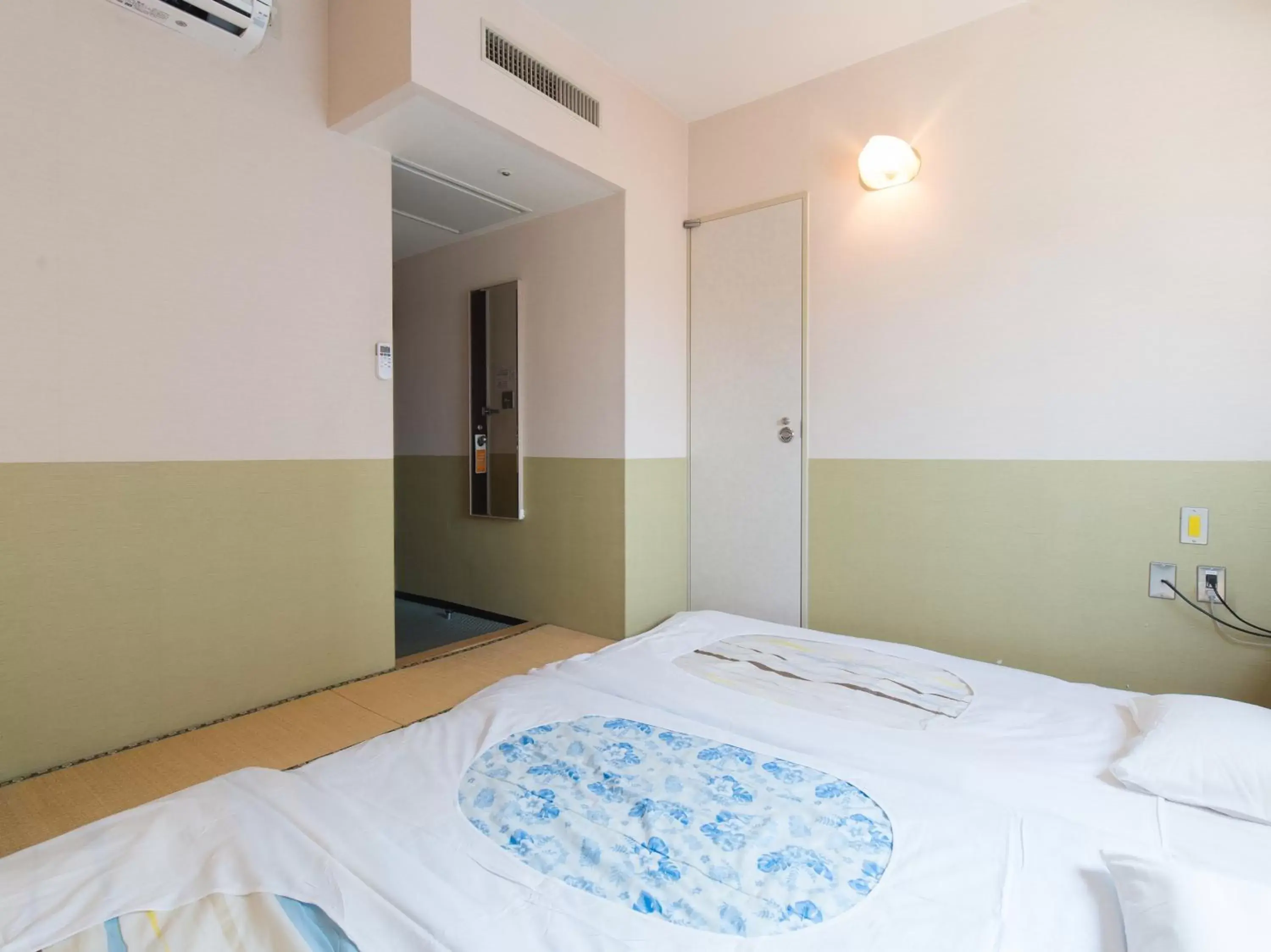 Bed in Tabist Hotel Tetora Kitakyushu