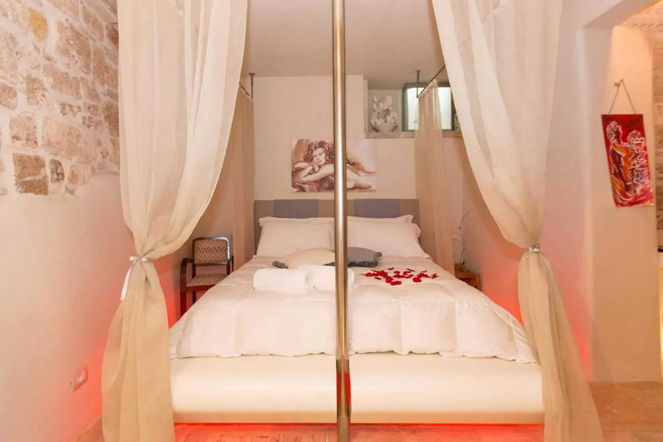 Bed in Antico Mondo Rooms & Suites