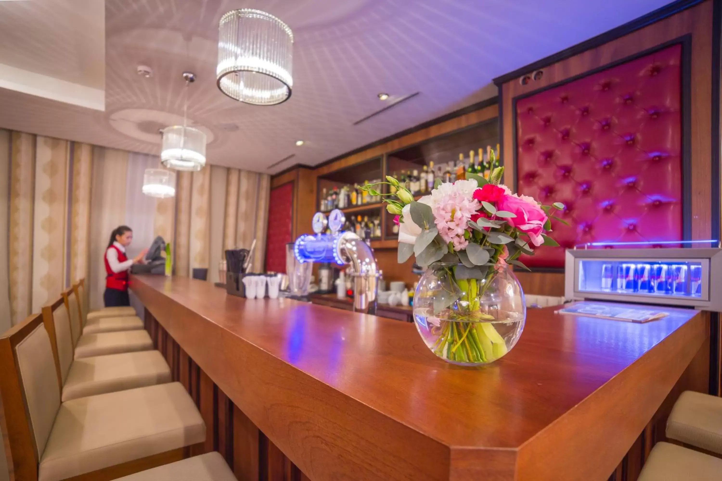 Lounge or bar in Ramada by Wyndham Almaty Lounge or bar in Ramada by Wyndham Almaty