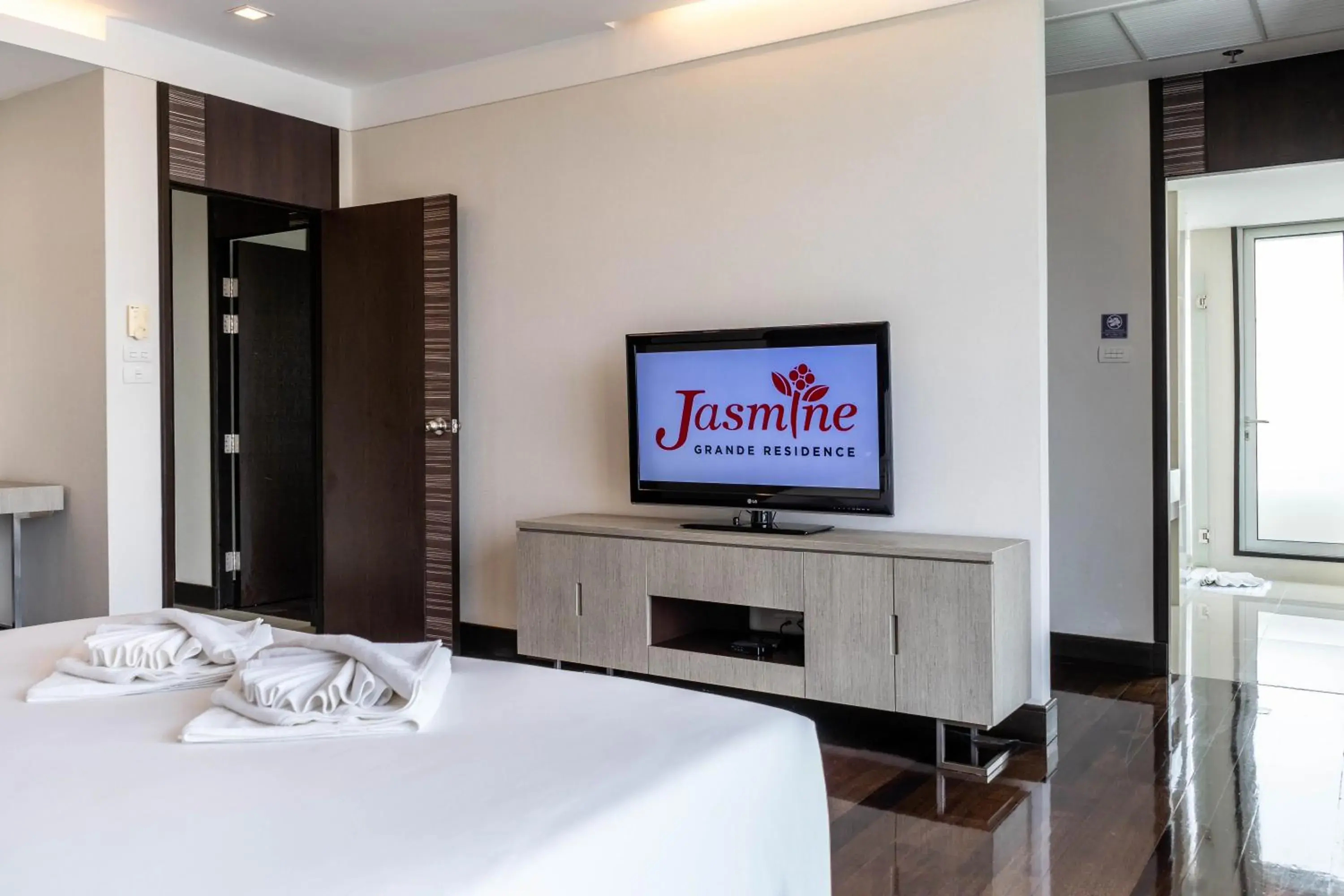 Bed, TV/Entertainment Center in Jasmine Grande Residence