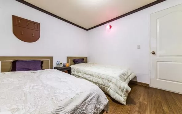 Bed in Saipan Motel with Sea View