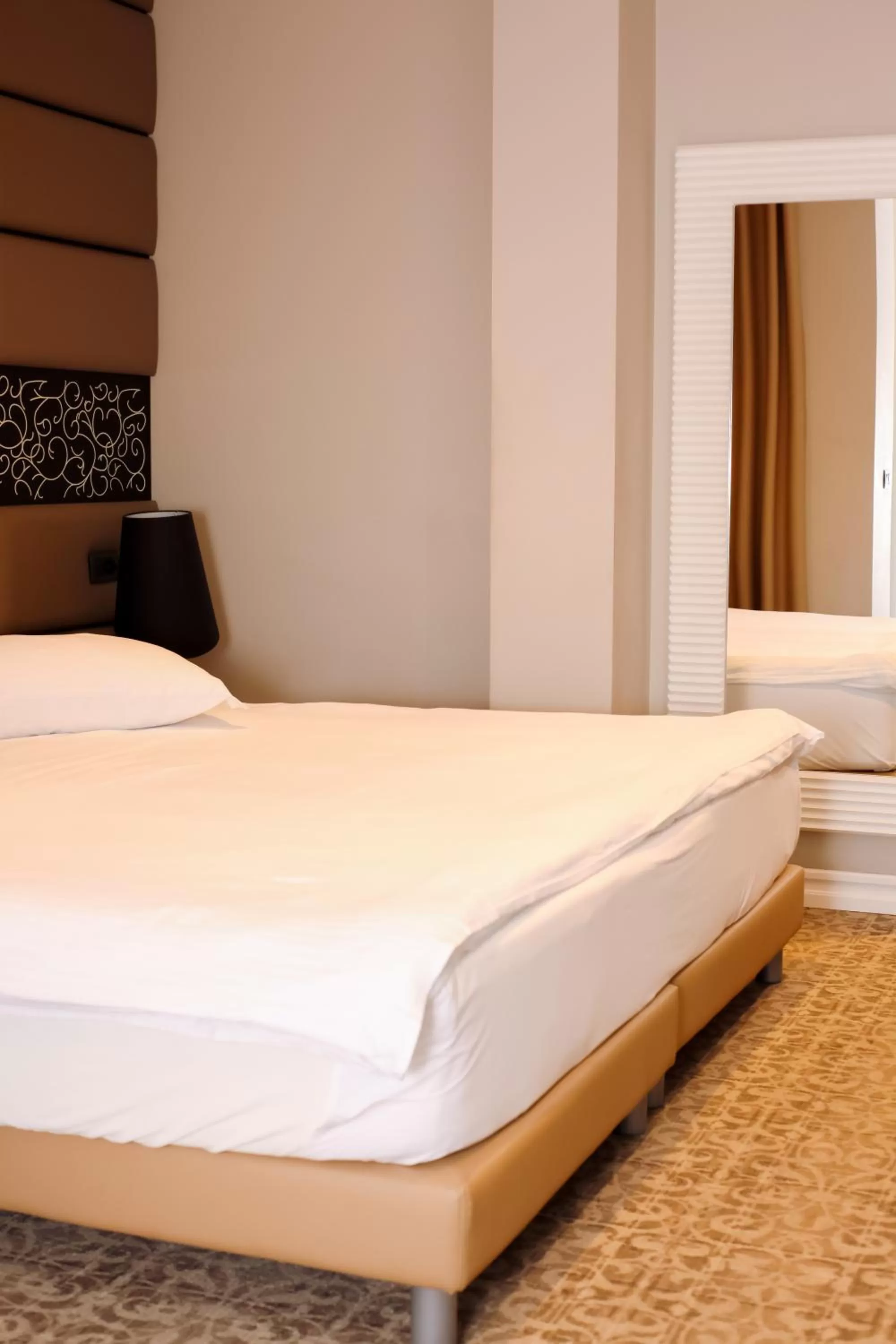 Bed in Senator Hotel