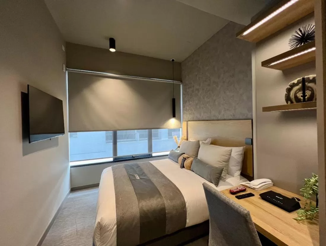 Bedroom in ICON 100 Luxury Apartasuites