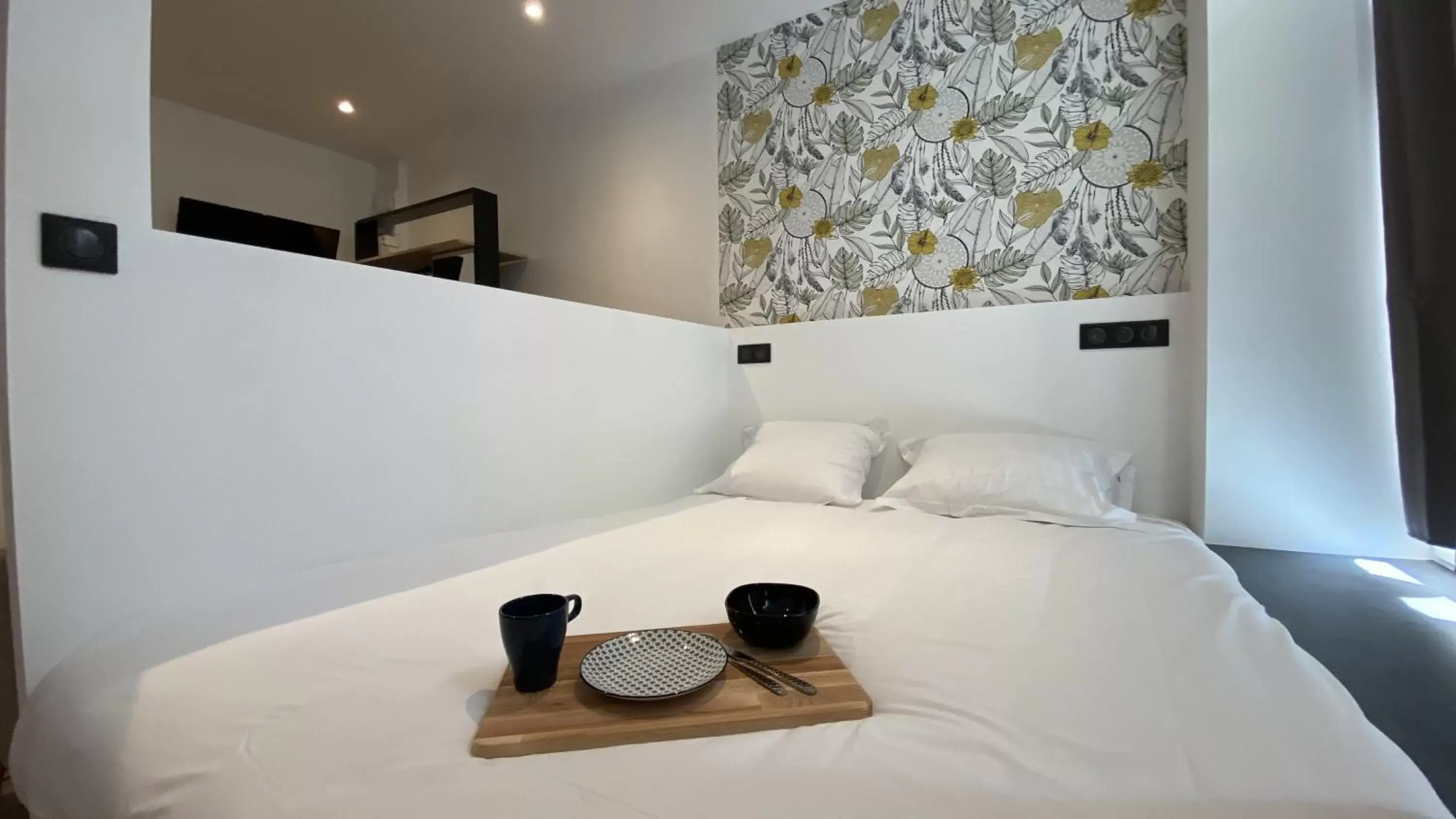 Bed in Le Bras d'or Apparts et Spa