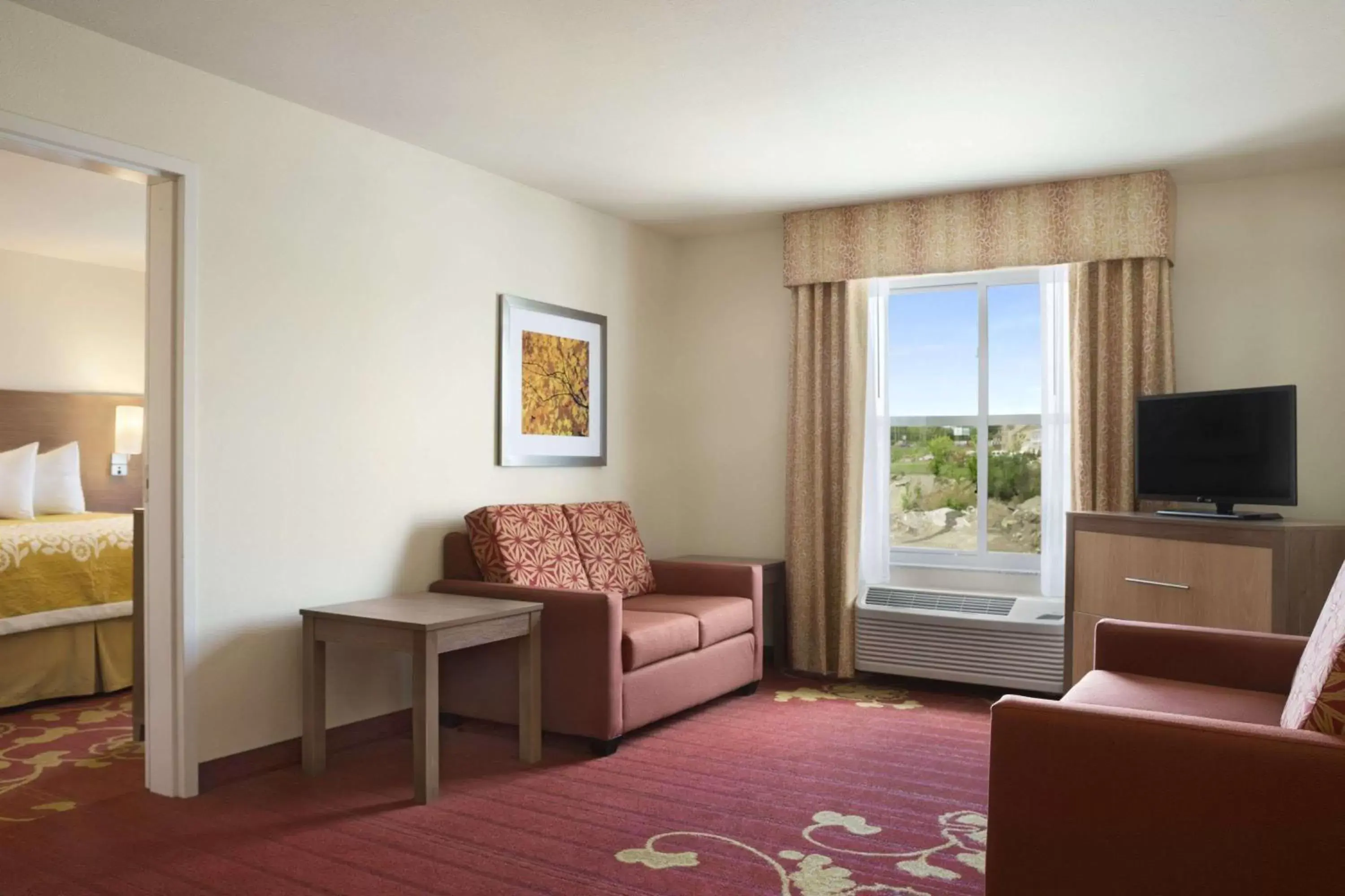 Photo of the whole room, Seating Area in Days Inn & Suites by Wyndham Belmont
