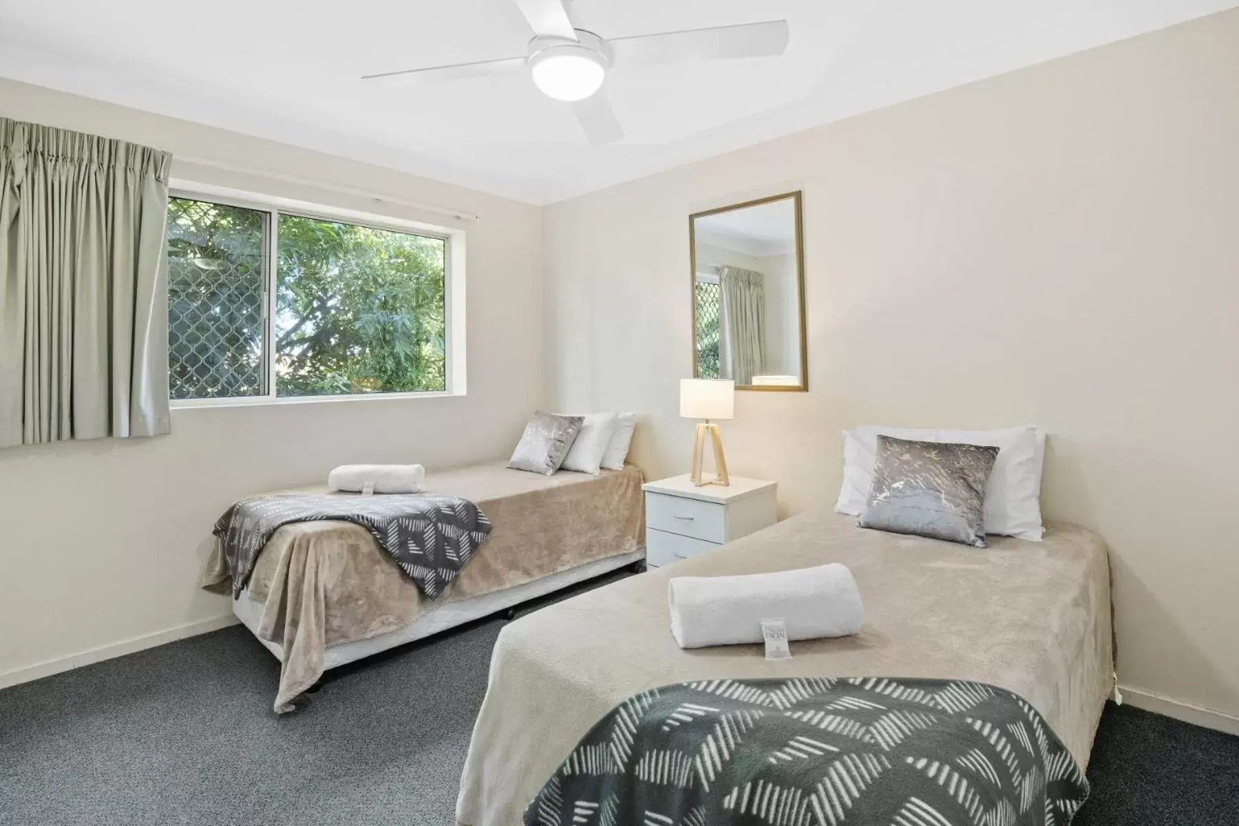 Bed in Kirra Palms Holiday Apartments