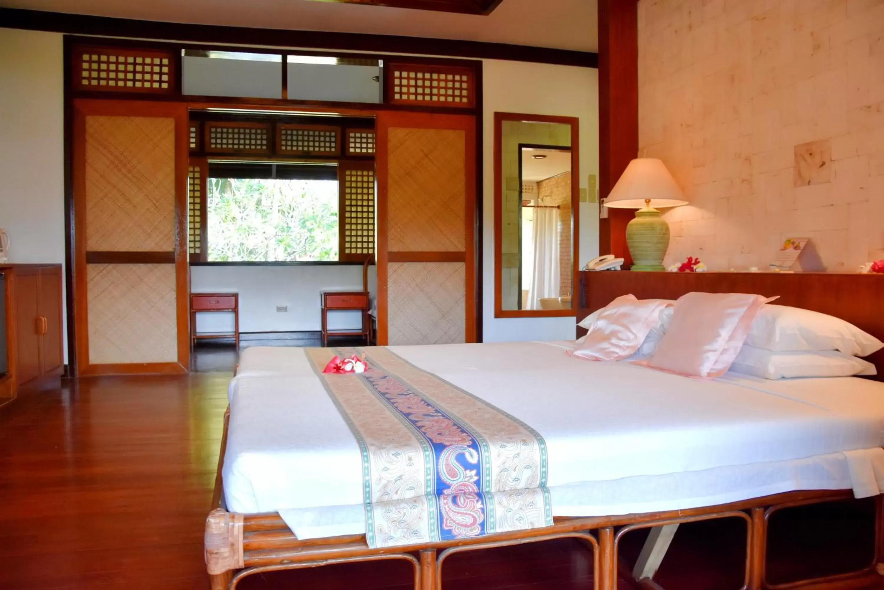 Bed in Badian Island Wellness Resort